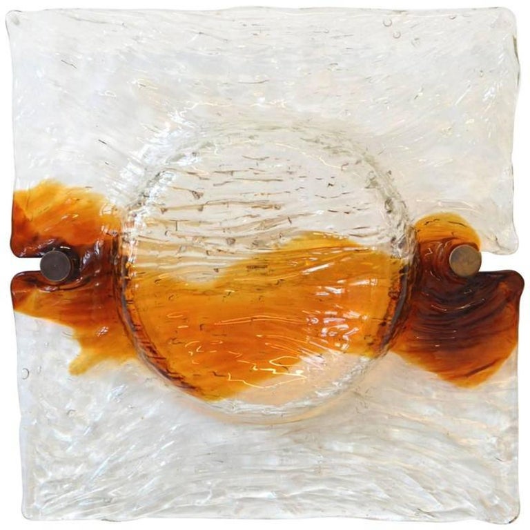 Five wall lamps
Toni Zuccheri by Venini
1960s

Transparent and amber Murano glass 
white metal frame and brass screws.
   