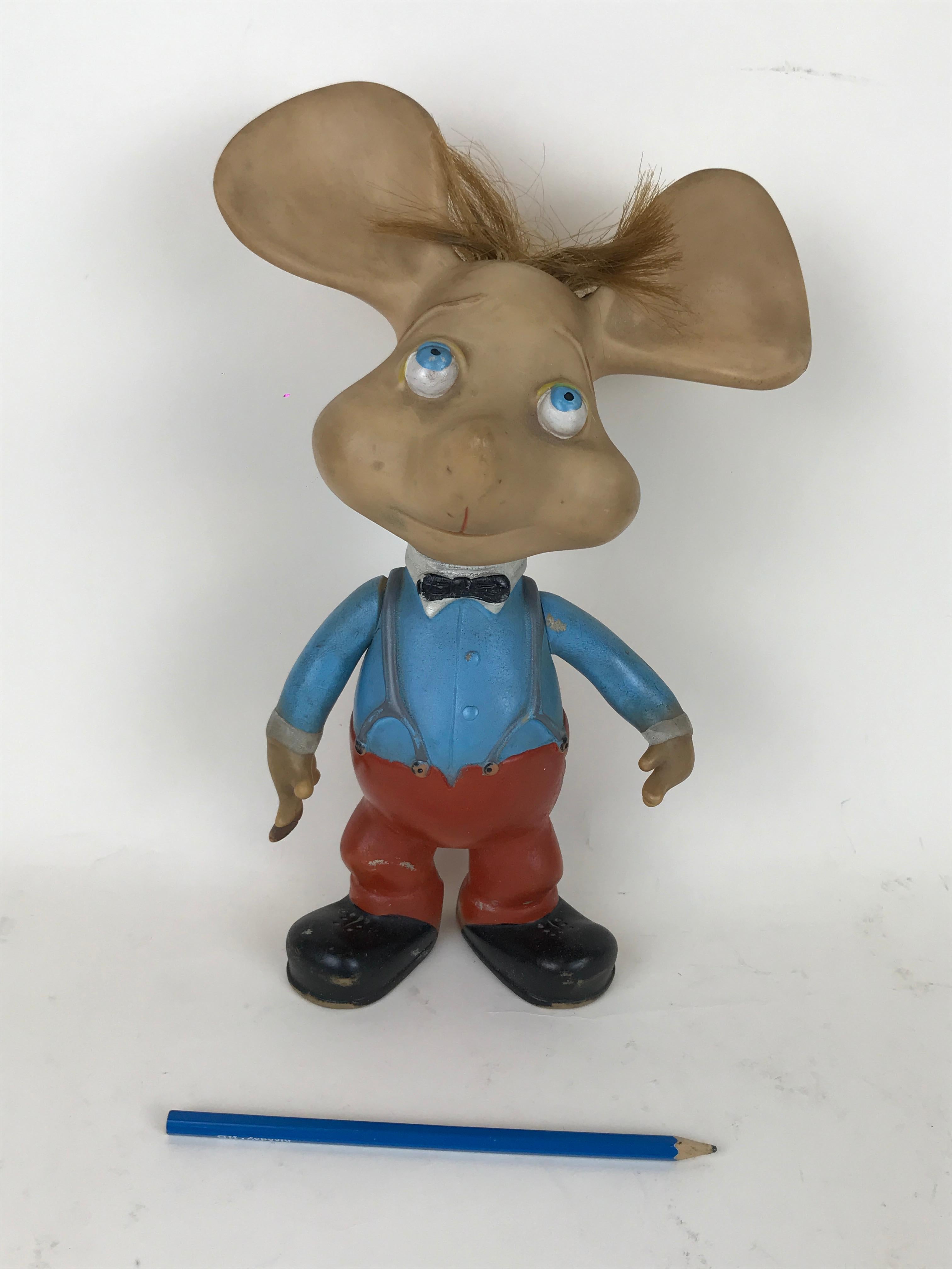 1960s iconic Topo Gigio mouse rubber squeak toy made in Italy, designed by Maria Perego in 1958.

The toy has movable arms and functioning whistle but doesn't have the original hat.

Collector's note:

Topo Gigio Mouse was the lead character