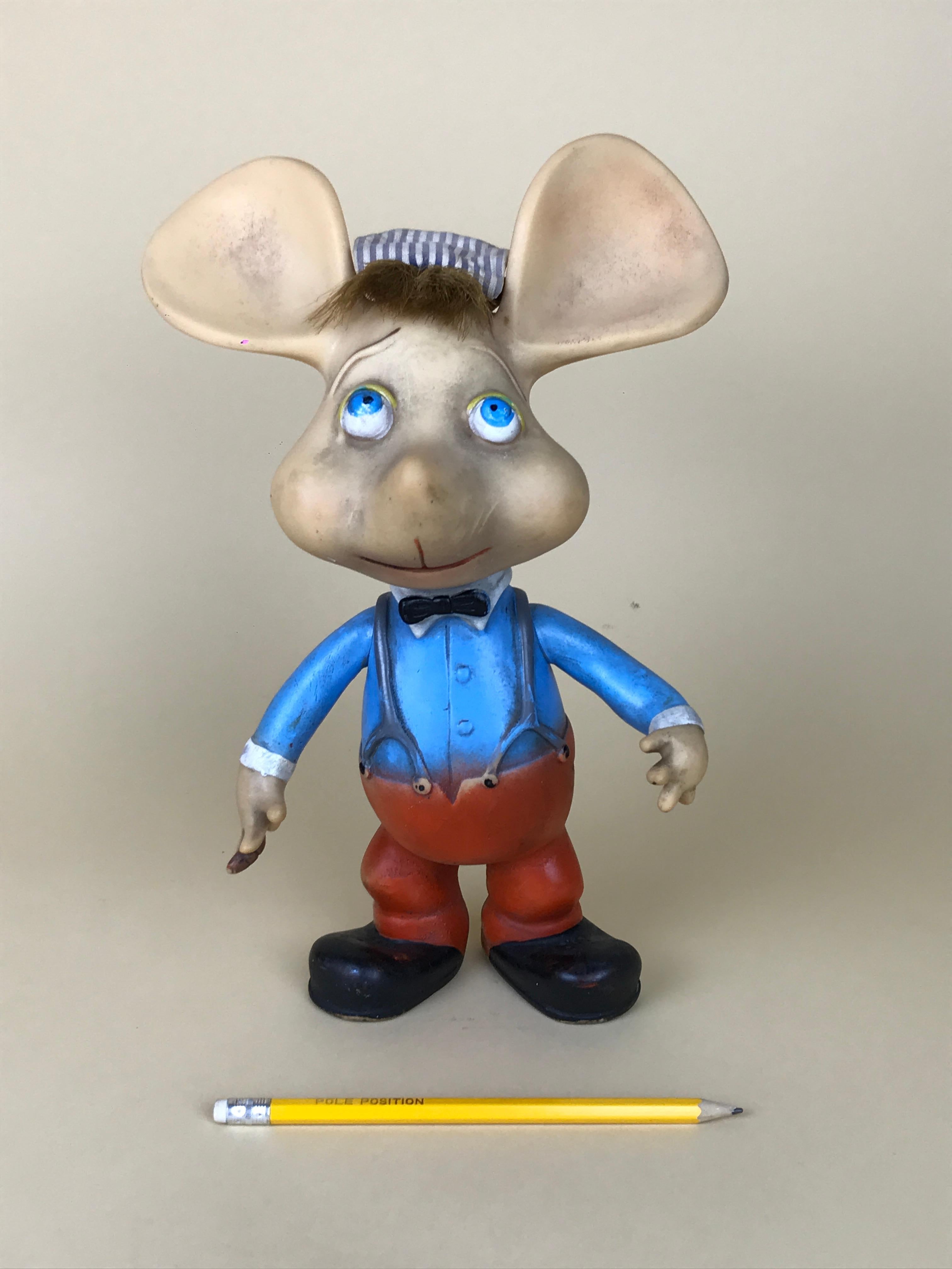 1960s iconic Topo Gigio mouse rubber squeak toy made in Italy, designed by Maria Perego in 1958.

The toy has the fabric original hat and movable arms.

Collector's note:

Topo Gigio Mouse was the lead character of a children's puppet show on