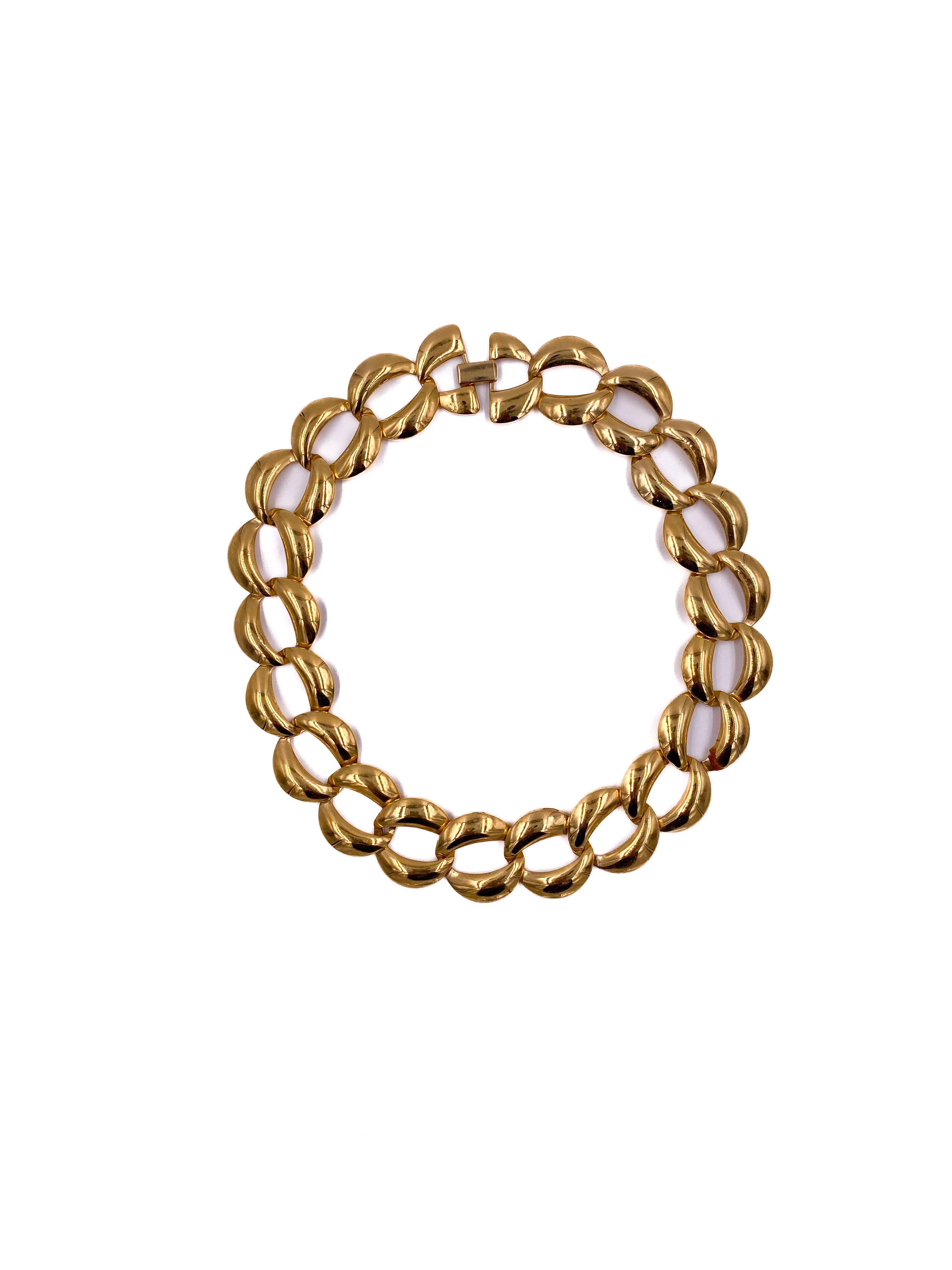 This 1960s Trifari Gold O-Chain Link Necklace features a timeless design with classic gold links that sit elegantly at the high neck. Its refined craftsmanship and vintage appeal make it a sophisticated accessory, perfect for adding a touch of