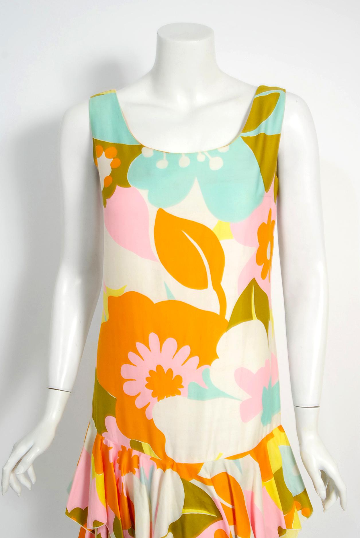 Truly a wonderful and unusual designer sundress from Sara's Las Vegas boutique. I think this is one of the best examples of 1960's flower power fashion I have seen in a long time. The design was obviously inspired by Pierre Cardin who was a leader