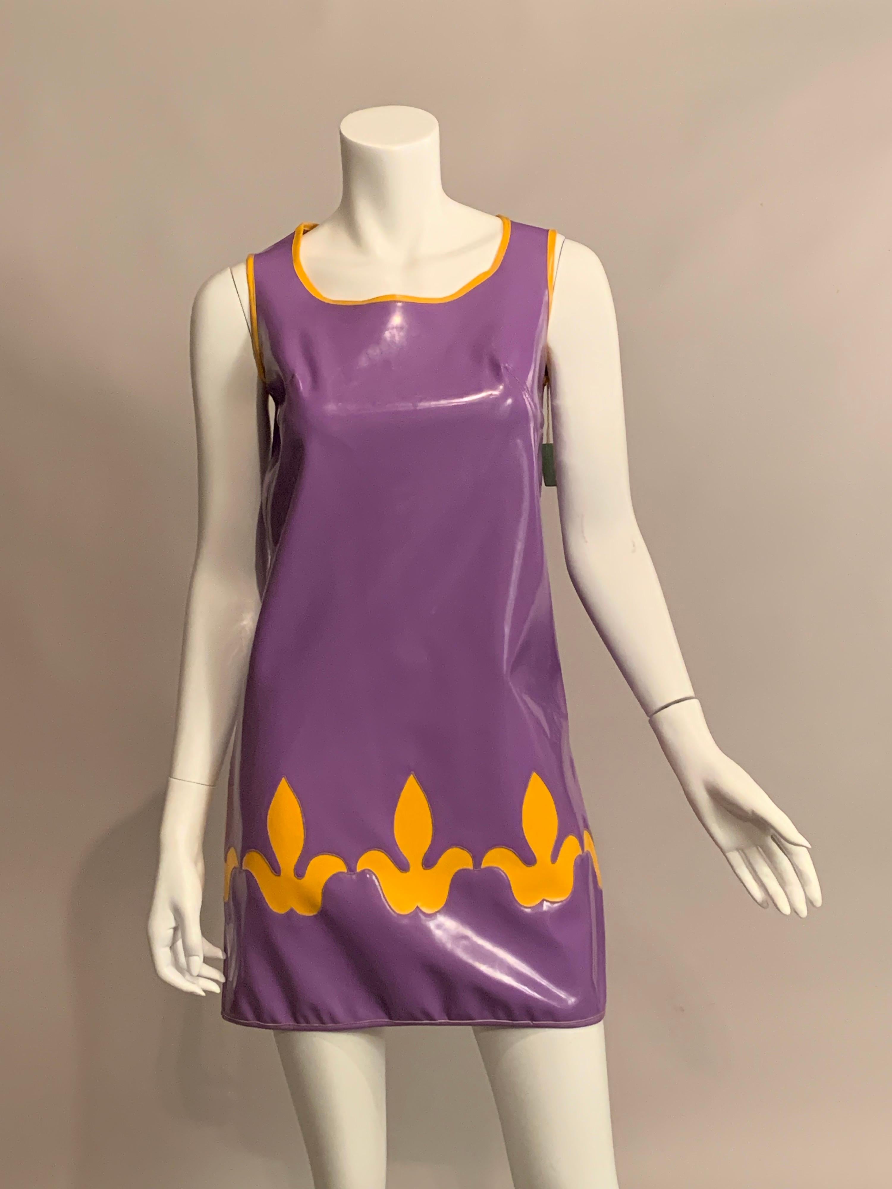 This rare and collectible lavender and yellow vinyl dress was designed by British Designers Tuffin and Foale circa 1968.  They had signed a three year contract with American company Puritan Fashions for their new division called Youthquake.  