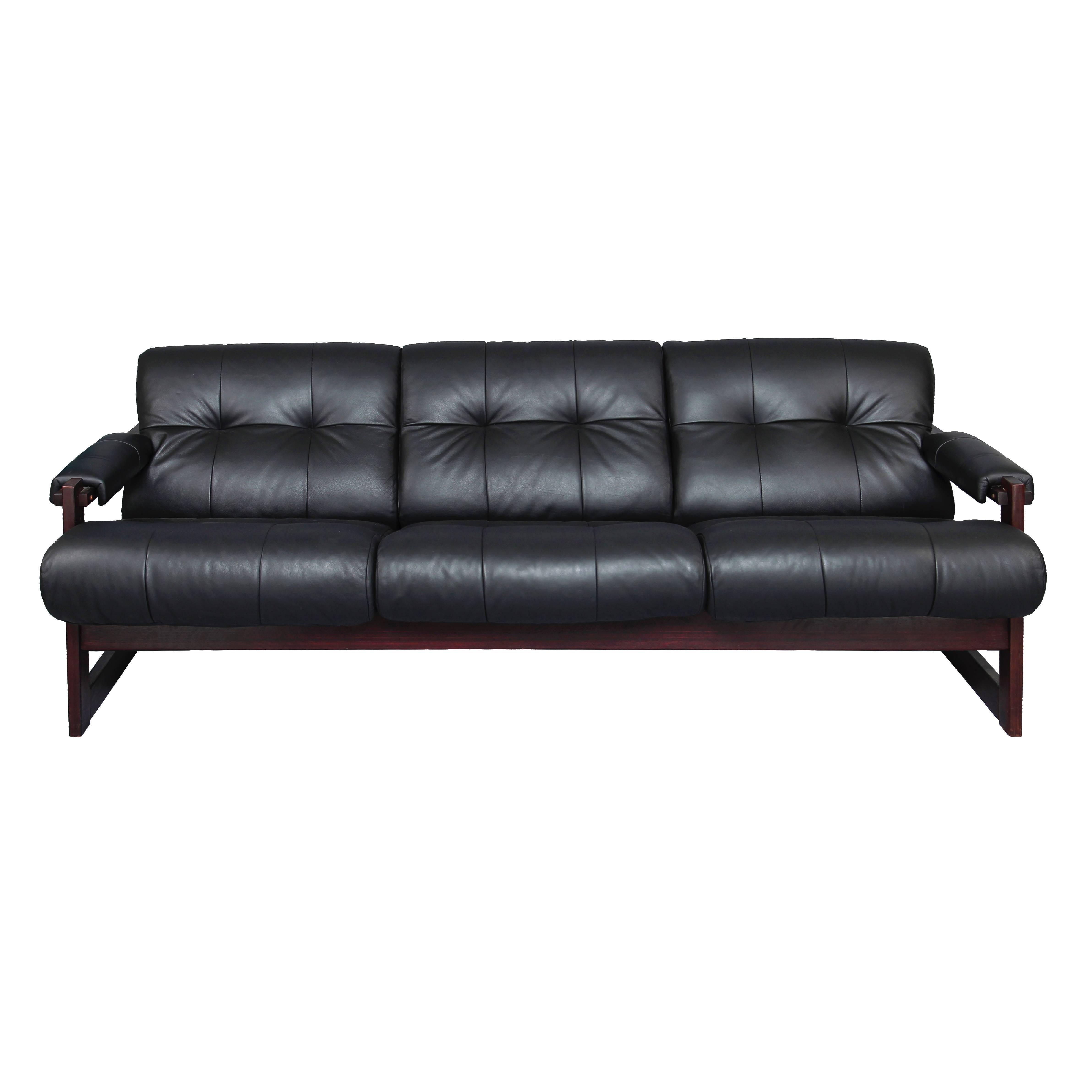 1960s tufted leather sofa with Jatoba Wood Frame by Percival Lafer. This Model MP-167 was produced by Lafer MP in Brazil.

Percival Lafer is a contemporary Brazilian furniture maker and Pioneer of the Brazilian Modernist movement. He is most