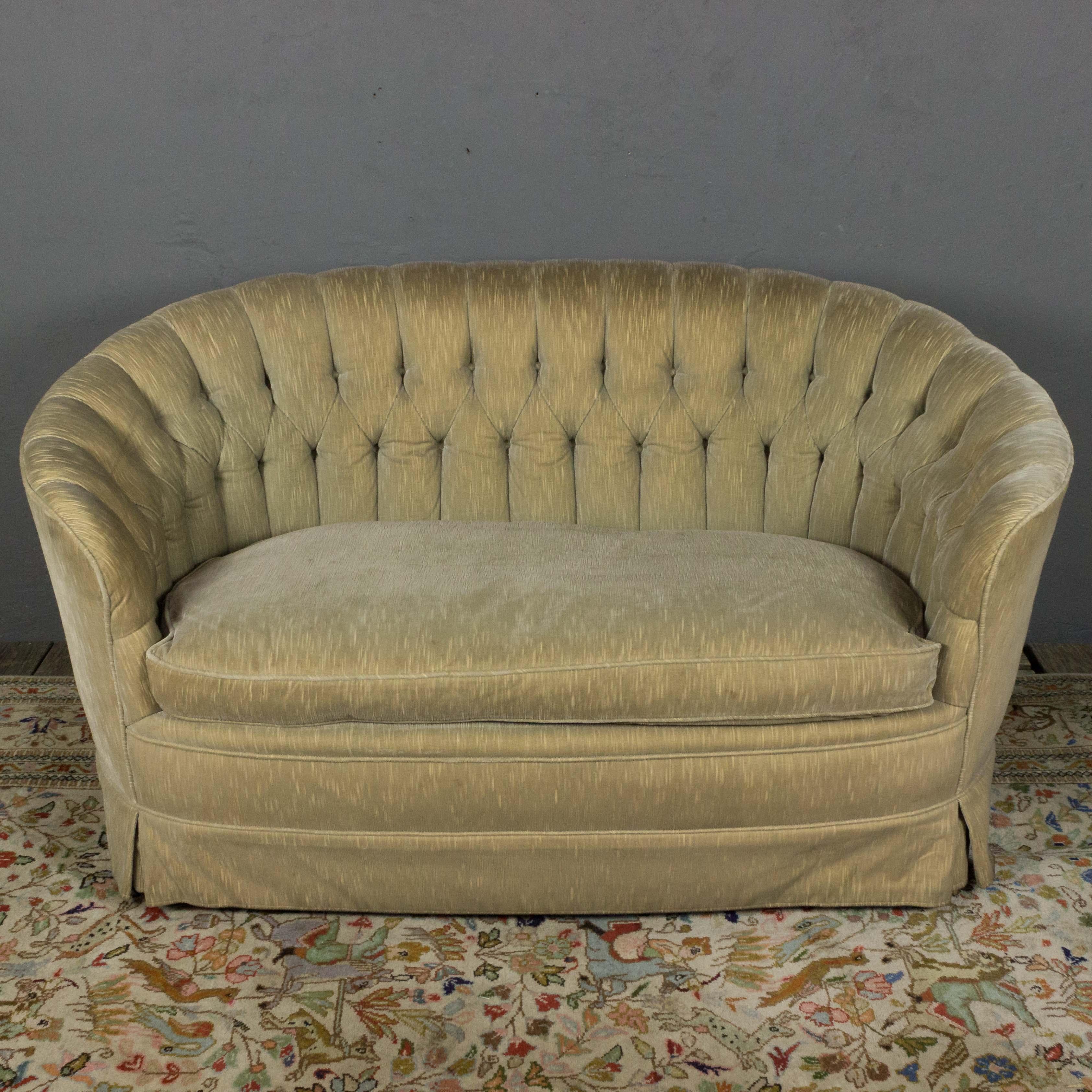 A comfortable tufted back settee with a single large seat cushion, original upholstery. American made, circa 1960. Good vintage condition. Arms will need tightening if reupholstering this piece.

 Ref #: ST0217-02

Dimensions: 30”H x 60”W x 30”D
