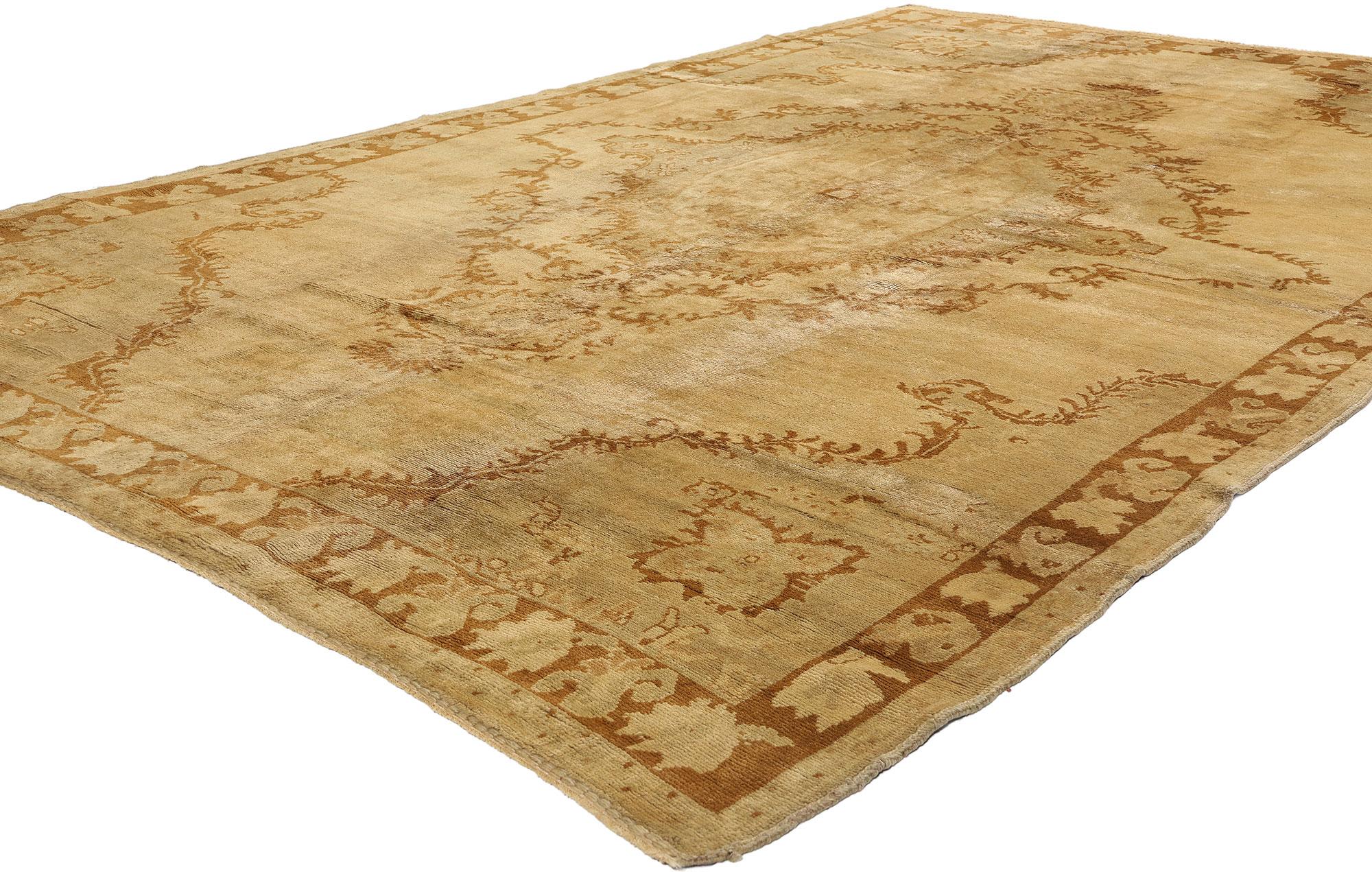 50448 Vintage Earth-Tone Turkish Oushak Rug, 06'08 x 10'08. Bathed in a golden warmth, this hand-knotted wool vintage Turkish Oushak rug unfurls like an ancient manuscript, its every motif a whispered tale from Anatolia’s storied past. At its heart,