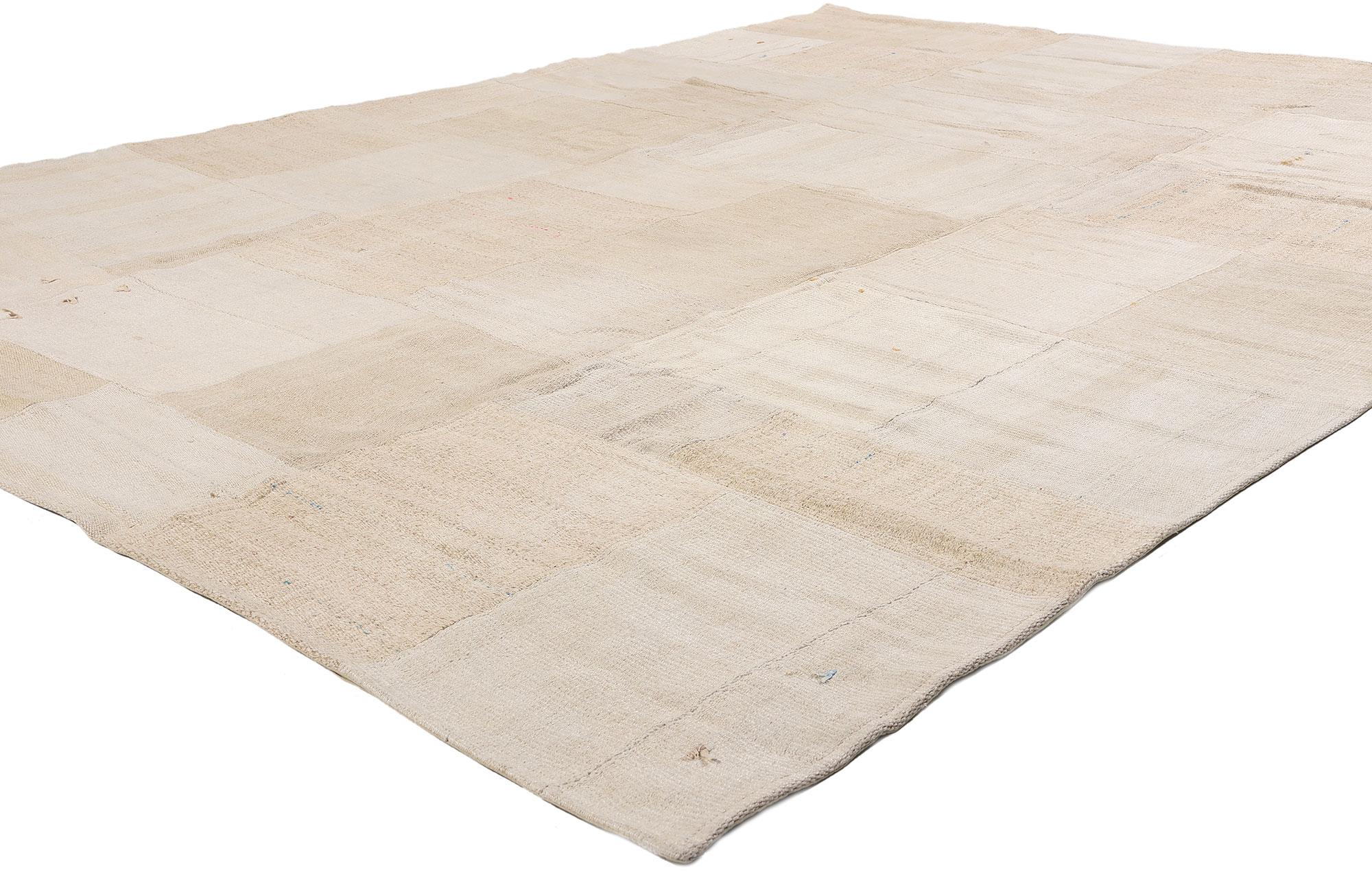 53527 Vintage Turkish Patchwork Kilim Rug, 09'00 x 11'11. Woven from the whispers of Anatolian earth and softened by time’s gentle hand, this handwoven wool vintage Turkish patchwork kilim rug radiates a tranquil, sun-bleached elegance. A mosaic of