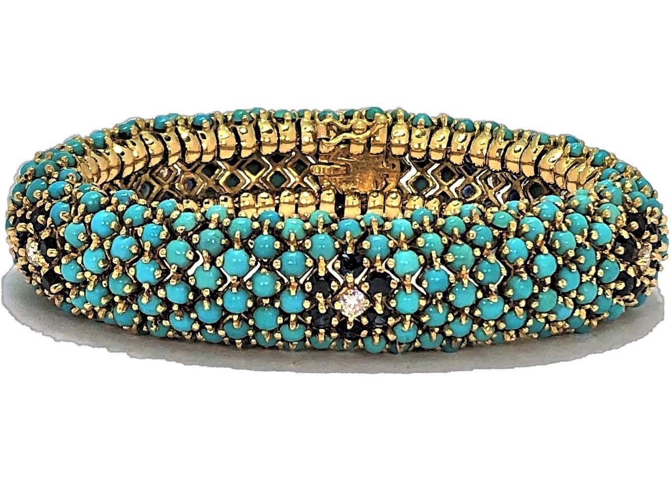 This beautiful 1960s flexible bombe bracelet in made of 18K yellow gold and is set with turquoise beads and with five sapphire and diamond flower stations. Each flower consists of six sapphires surrounding a diamond center. The 30 sapphires have a