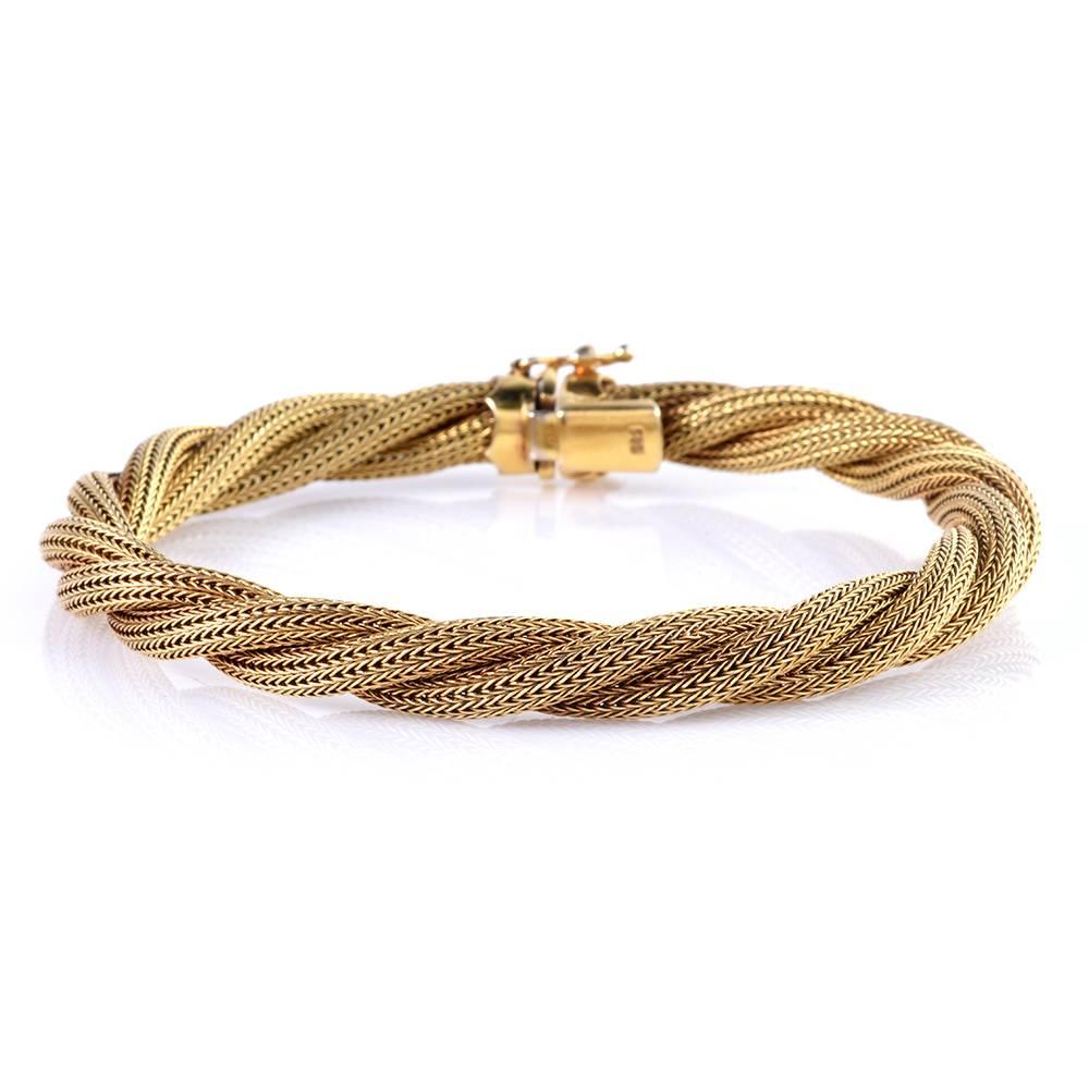 This immaculately crafted 1960's Vintage mesh bracelet is rendered in 14-karat matted Gold. With an immaculate twisted rope design, this pleasantly flexible vintage bracelet weighs 18.6 grams and measures 7.5 inches long and 7 mm wide. It features