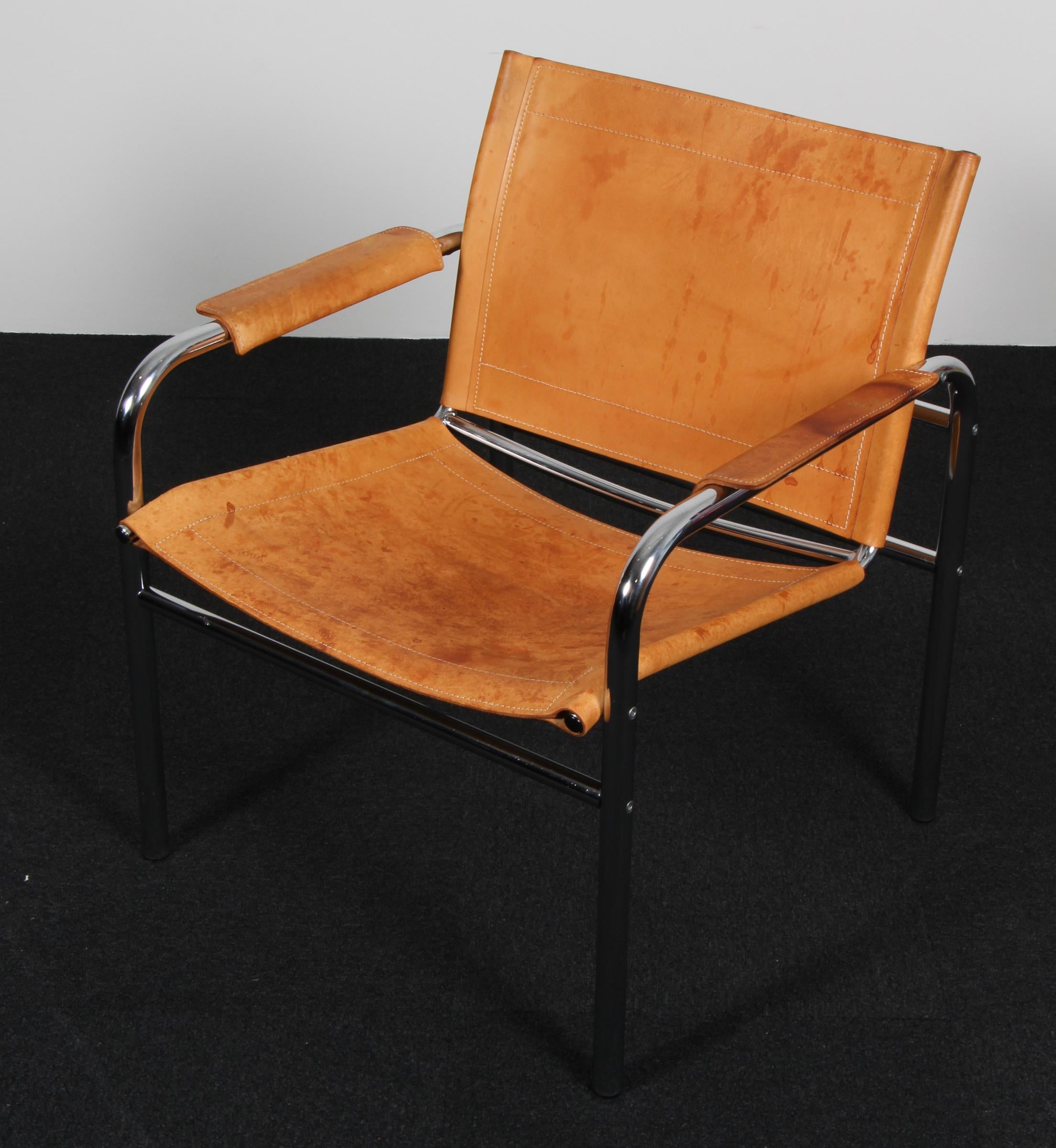 Nice armchair , model Klinte, designed by Tord Björklund Sweden.
The chairs having a tubular chromed steel frame with patinated nature leather back seating and armrest with a beautiful patina.
Period 1960s
Dimensions: H.74 cm , W.68 cm ,D.60 cm ,