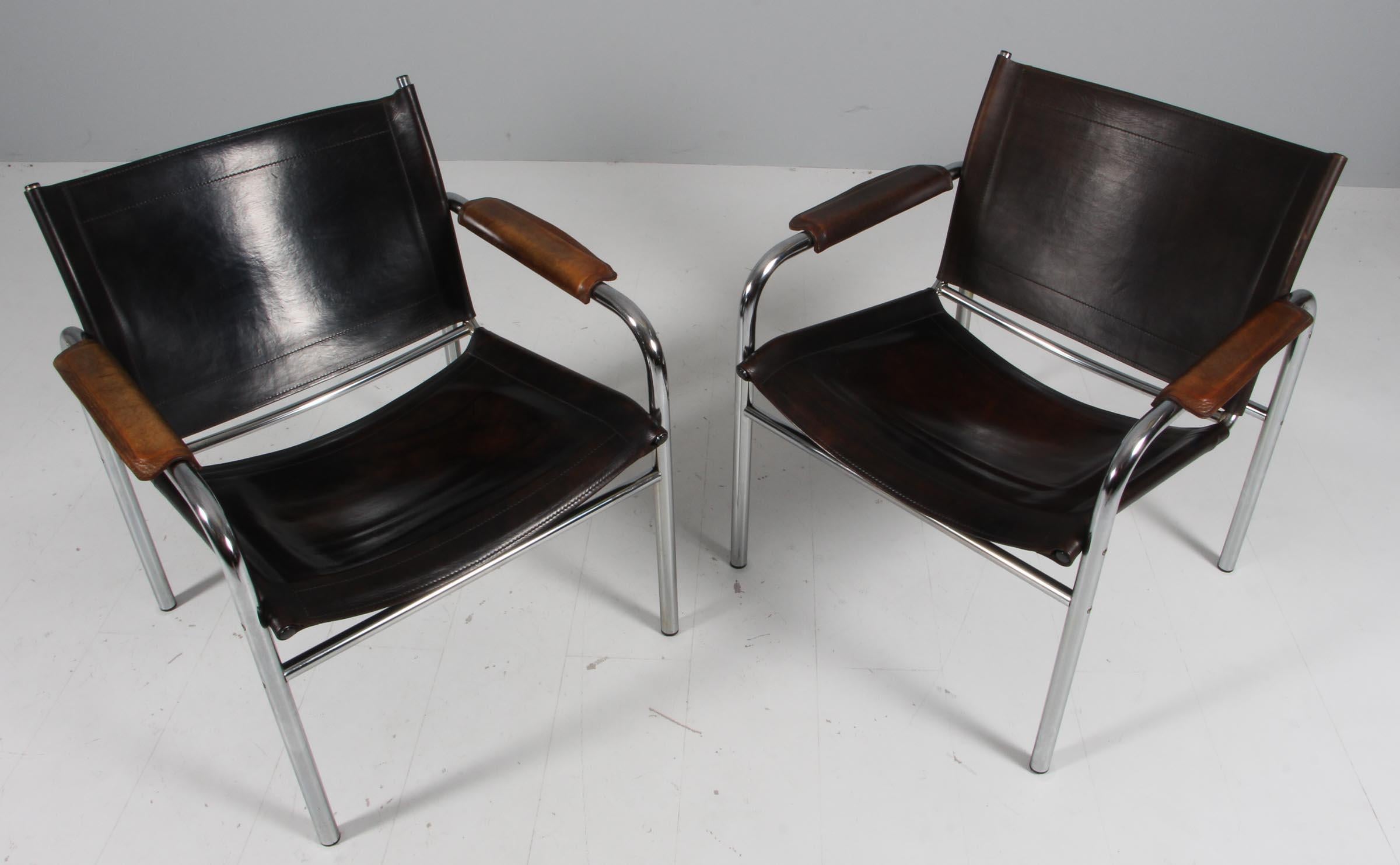 Very nice pair of armchairs, model Klinte, designed by Tord Björklund Sweden.
The chairs having a tubular chromed steel frame with patinated black leather back seating and armrest with a beautiful patina.
Period 1960s
Dimensions: H.74 cm , W.68 cm