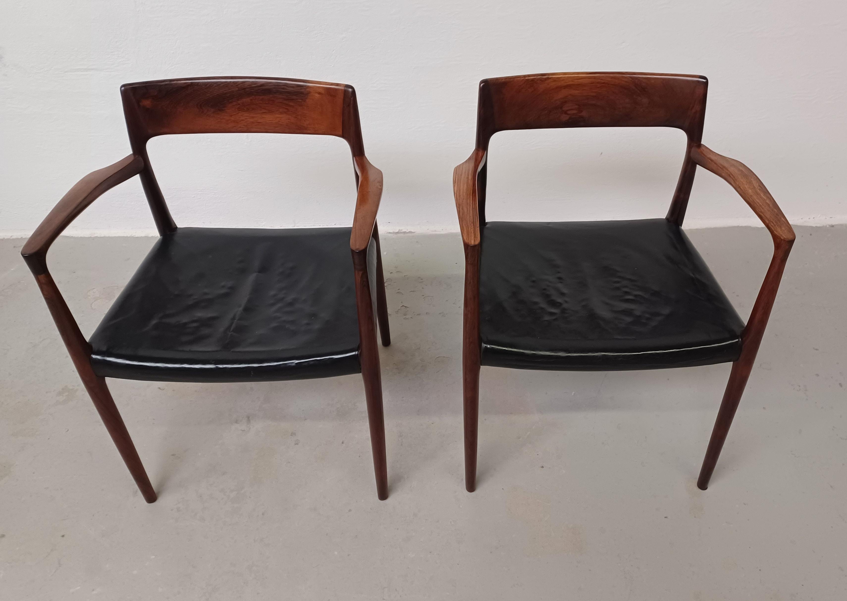 1960s two restored N. O. Møller rosewood model 57 Armchairs custom upholstery 

Set of two of Niels Otto Møllers iconic model 57 armchairs in Brazilian rosewood The model that is very rare in rosewood was designed in 1959 by Niels Otto Møller for