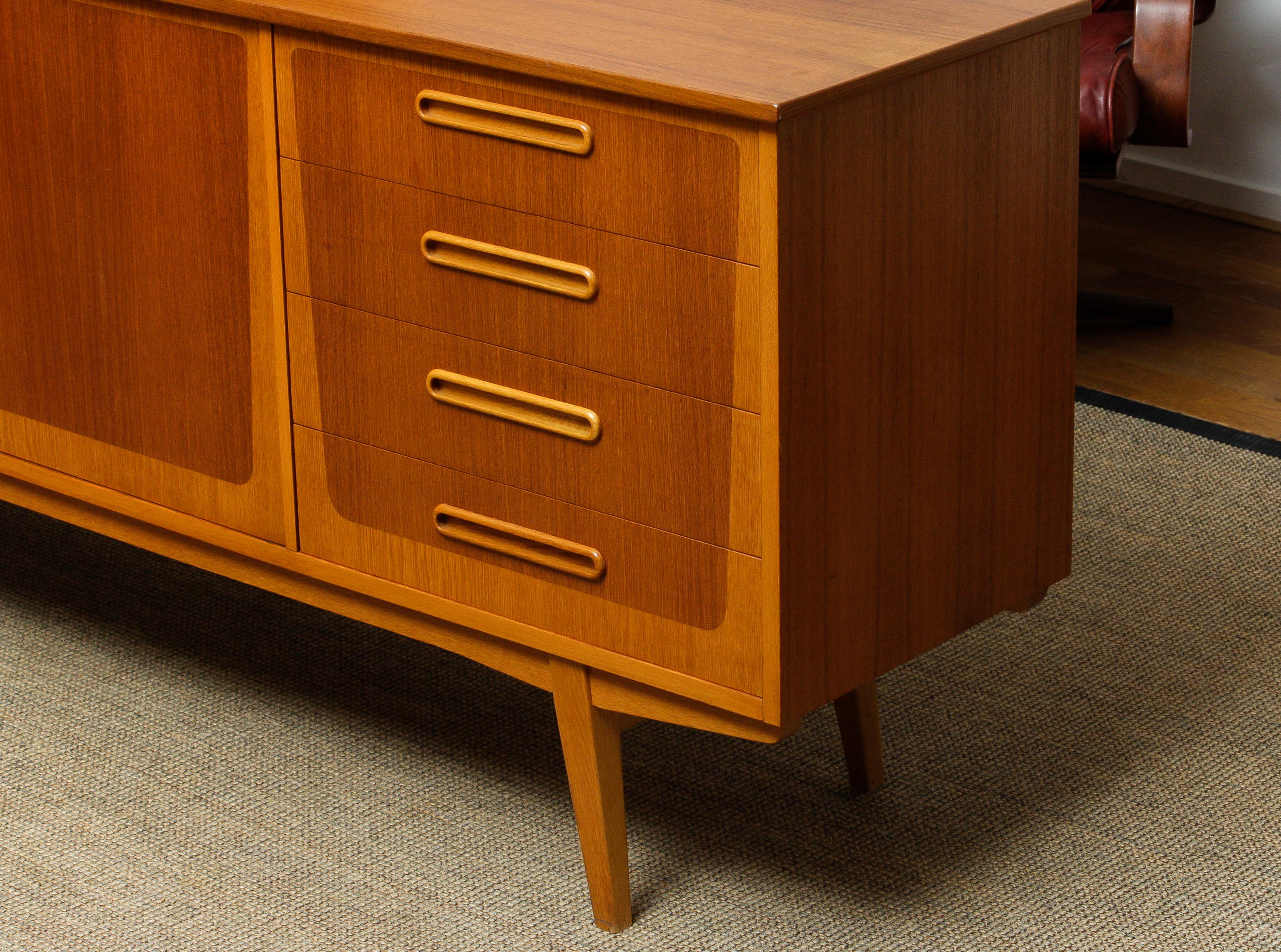 Beautiful sideboard / credenza made in Sweden in the 1960s consisting four drawers and two doors with behind the doors a shelf.
The overall condition is good!