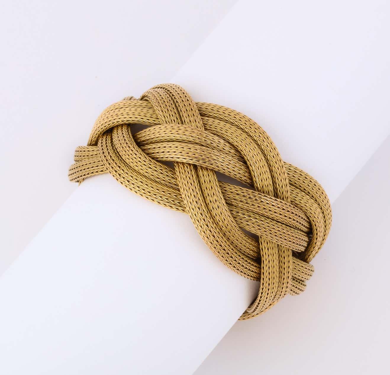 One Ladies 18kt Gold Flexible Mesh Bracelet Designed In An Interlocking Twist And Braided Motif. Circa 1960's. Designed By Tambetti Jewelers.