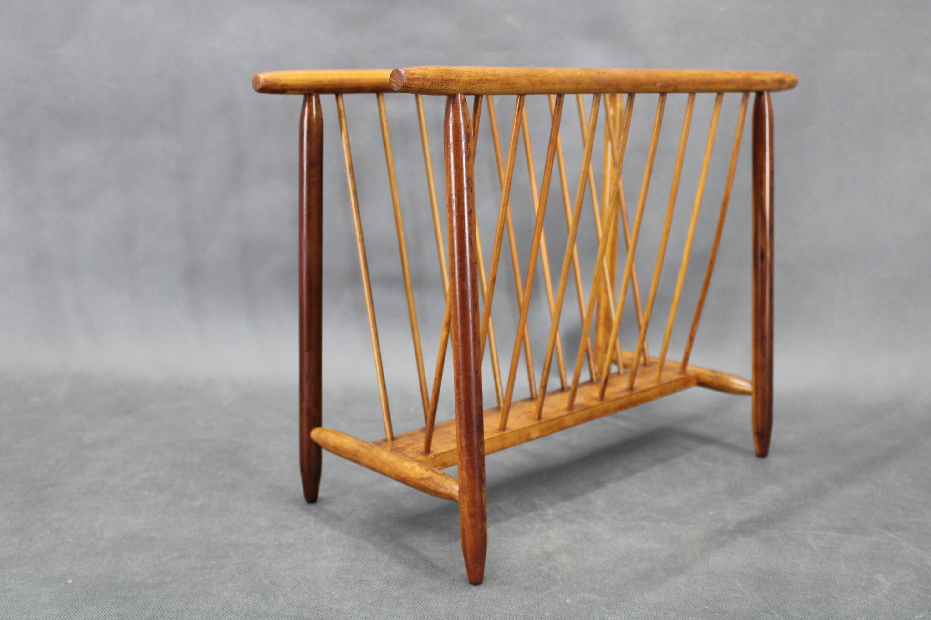 Mid-century magazine or newspaper stand designed and produced by ULUV, made in Czechoslovakia circa 1960. Crafted from solid beech wood, this piece showcases clean lines typical of period design. 
Presented in good original condition with minor