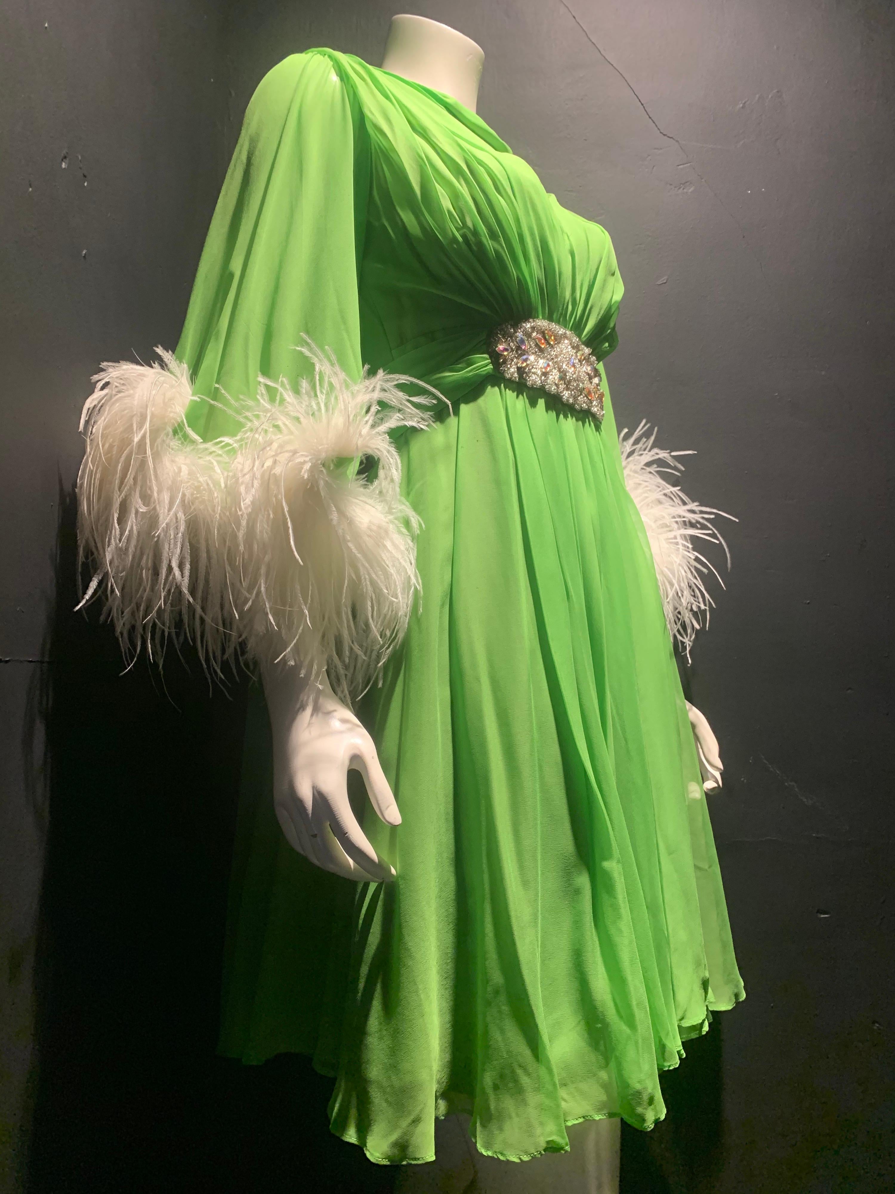 1960s Unlabeled lime green silk chiffon cocktail dress with jeweled belt and ostrich feather cuffs. Fully lined. Zipper back. Waterfall chiffon back and gathered bust. Size 4.