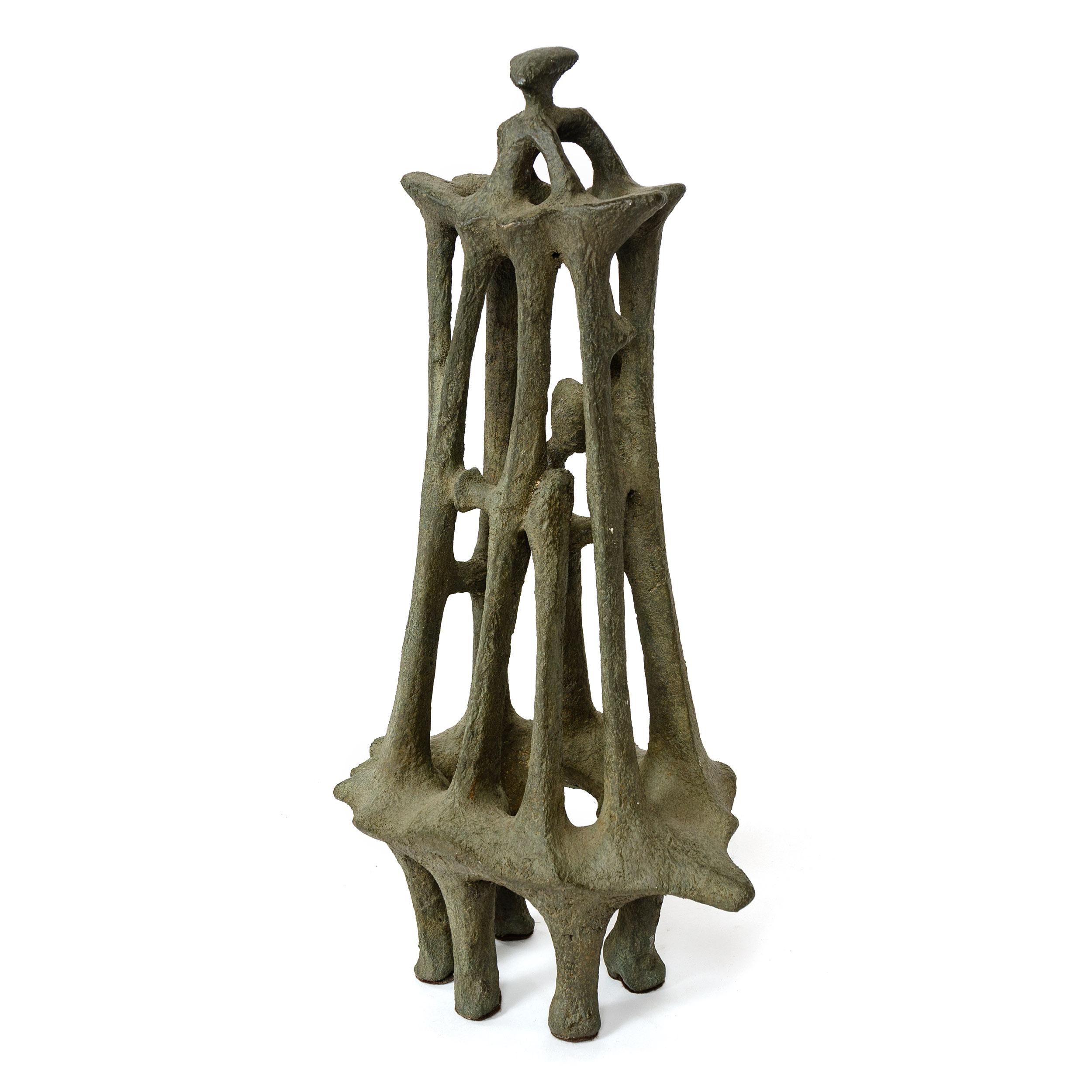 An unsigned vintage cast bronze abstract sculpture with natural patina.