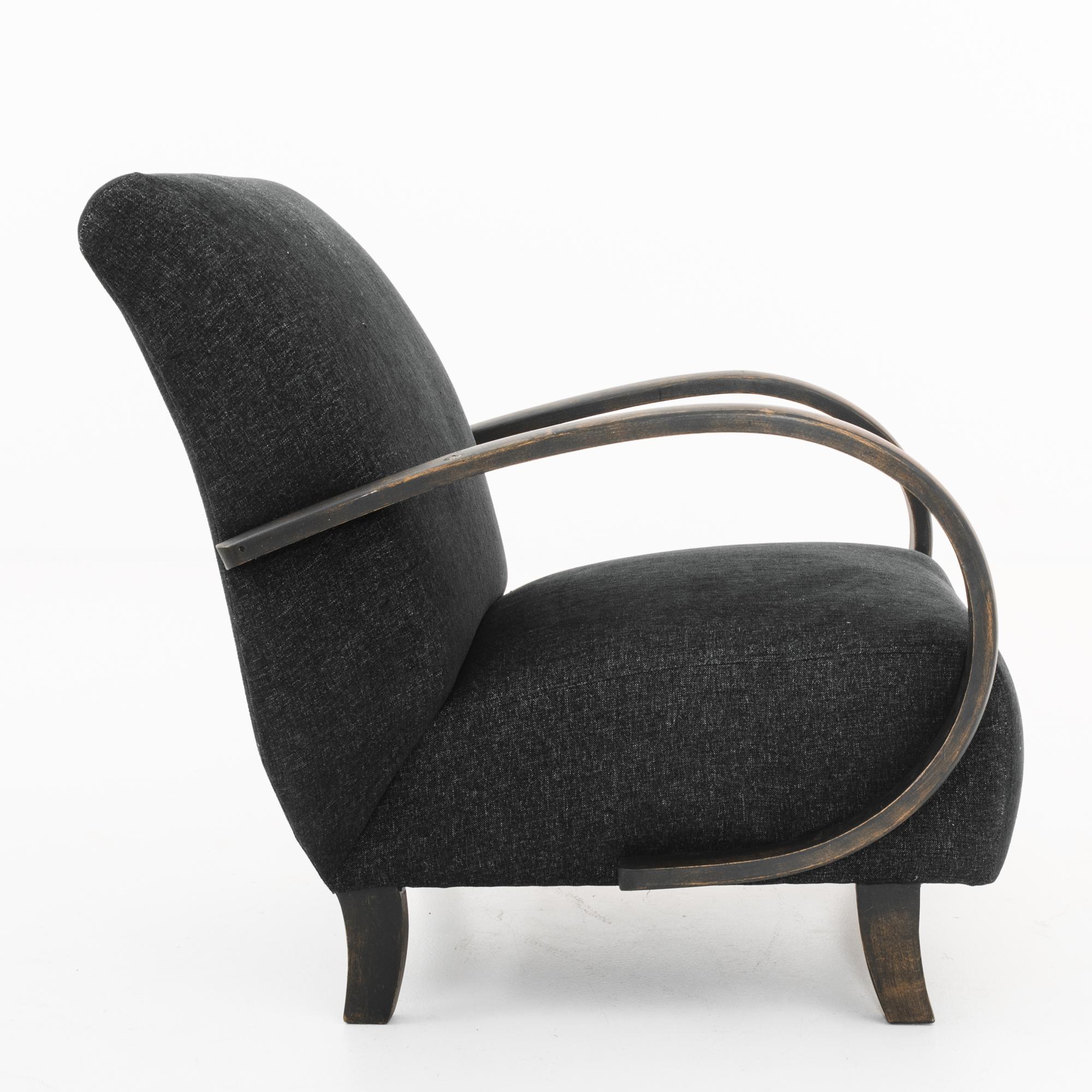 Mid-Century Modern upholstered armchair made in the former Czechoslovakia, circa 1960. A timeless approach that still looks contemporary and fresh. Designed by the modernist Jindrich Halabala, these armchairs feature his signature bent beech