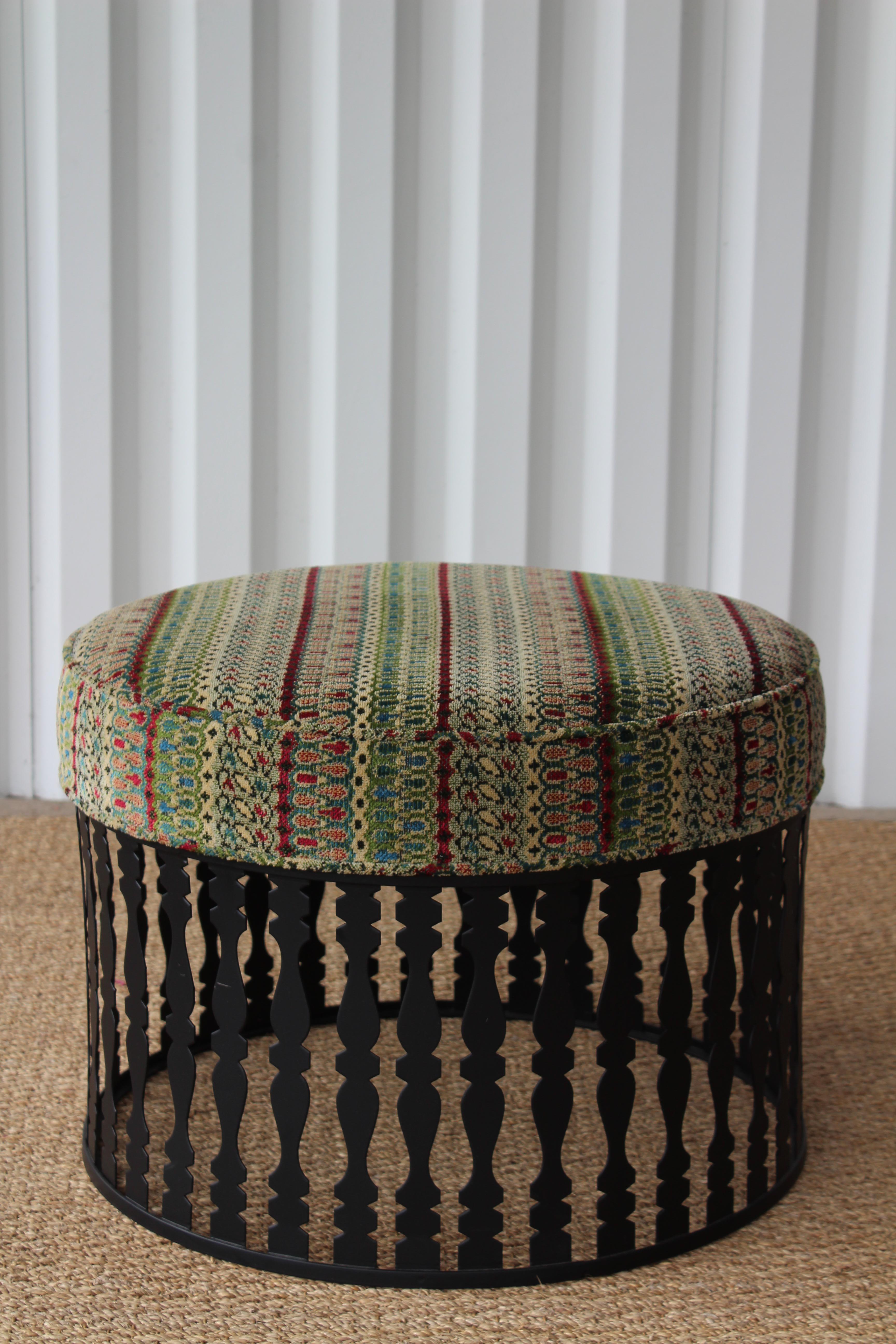 Vintage 1960s upholstered ottoman on a steel base. New upholstery. Newly powder-coated steel base. Excellent condition.
