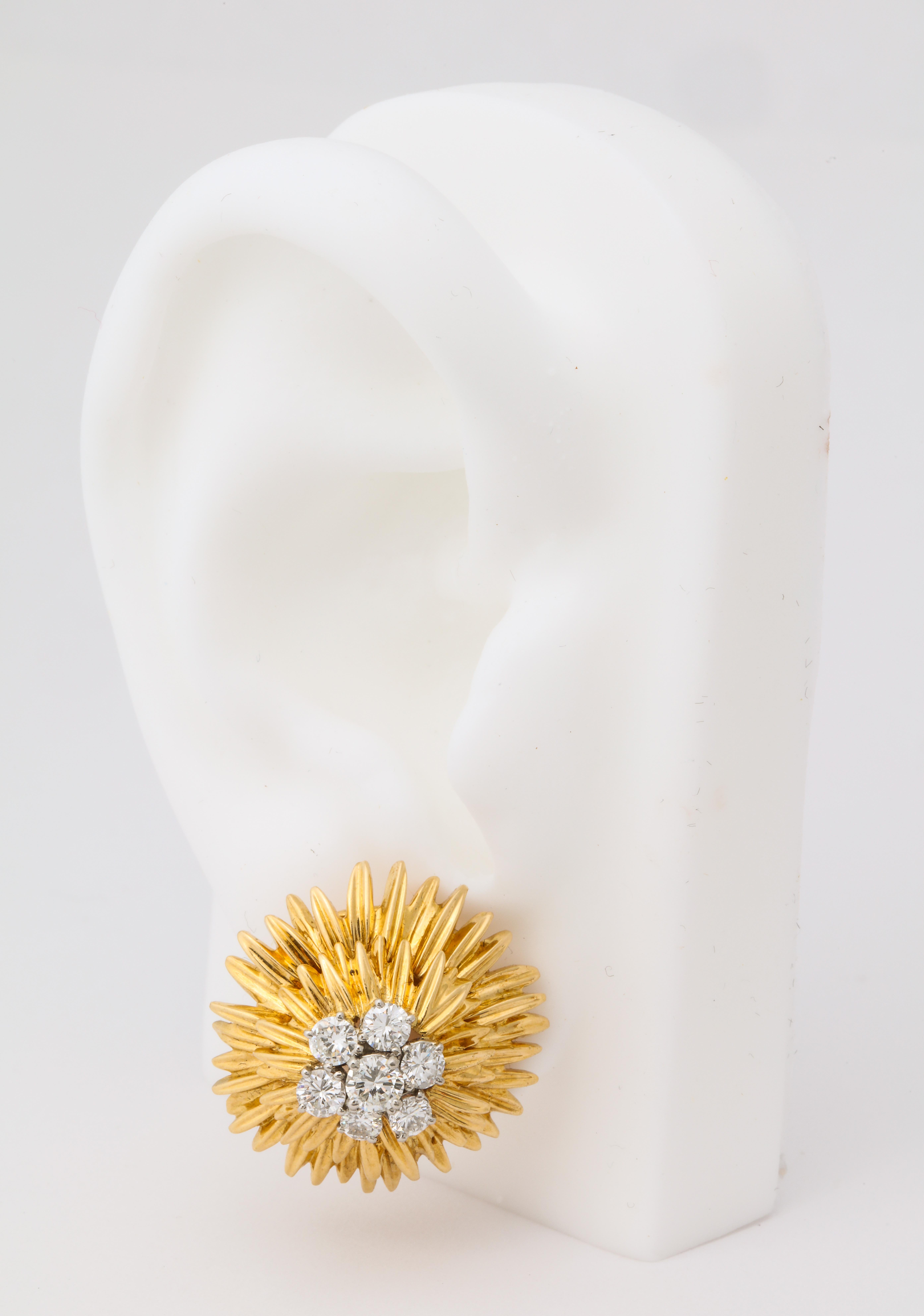Wonderfully three dimensional layered gold with a central diamond cluster, these earrings perfectly represent VCA's work in Paris during the 1960's.  They will sit perfectly on the ear, as they are made with a distinct right and left and feature
