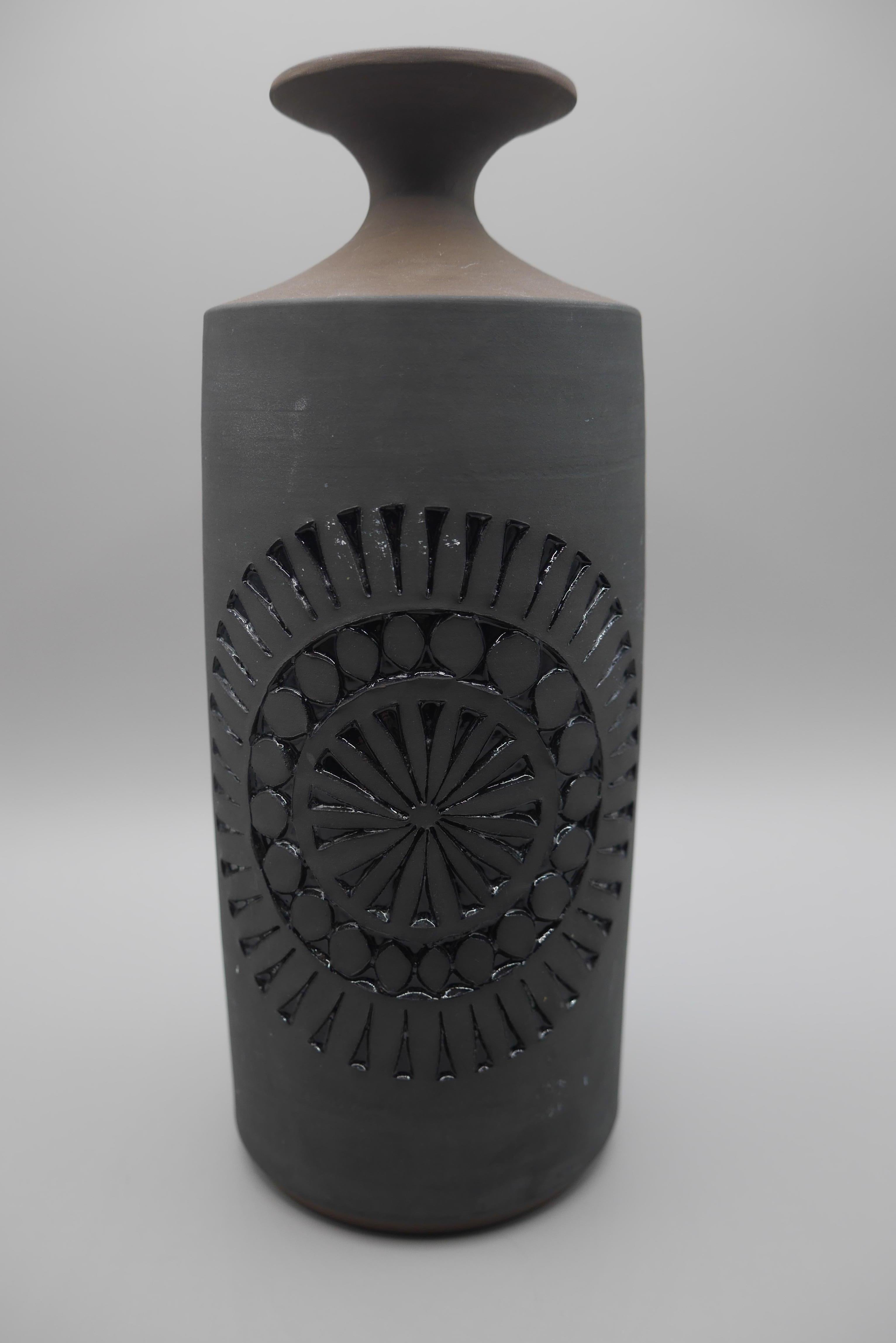 A beautiful, dark and subtle piece by Tomas Anagrius for Alingsås ceramics, Sweden. 

Alingsås Keramik was started in 1947 by Halvard Oldberg and Hilding Canemark. In the beginning, enamel work was a specialty, but they soon turned to the