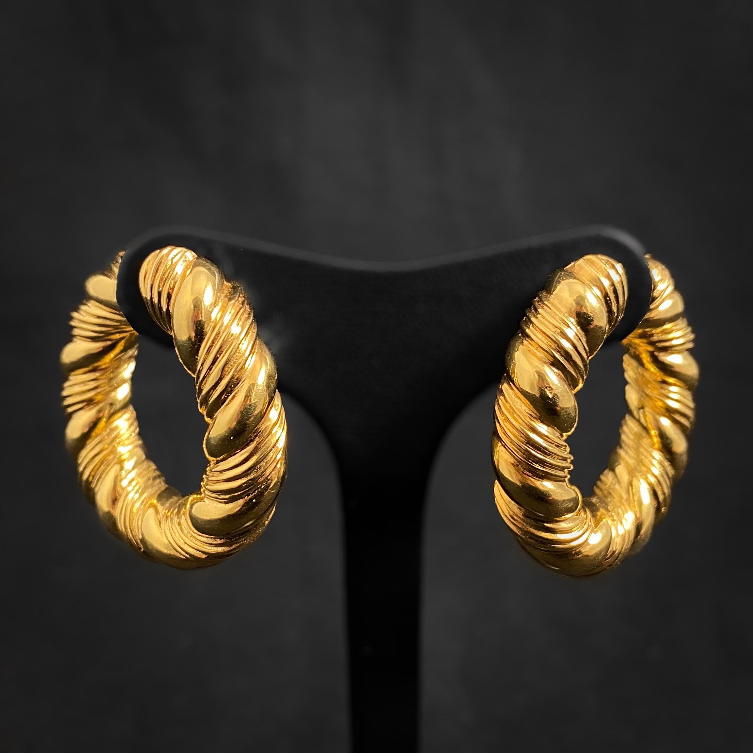 1960s Van Cleef & Arpels Braided Hoop Earrings in Yellow Gold, French, c. 1969. A pair of clip-on earrings suitable for both pierced and non-pierced ears, each designed as a yellow gold hoop with braided detailing. Comfortable and fashionable, these