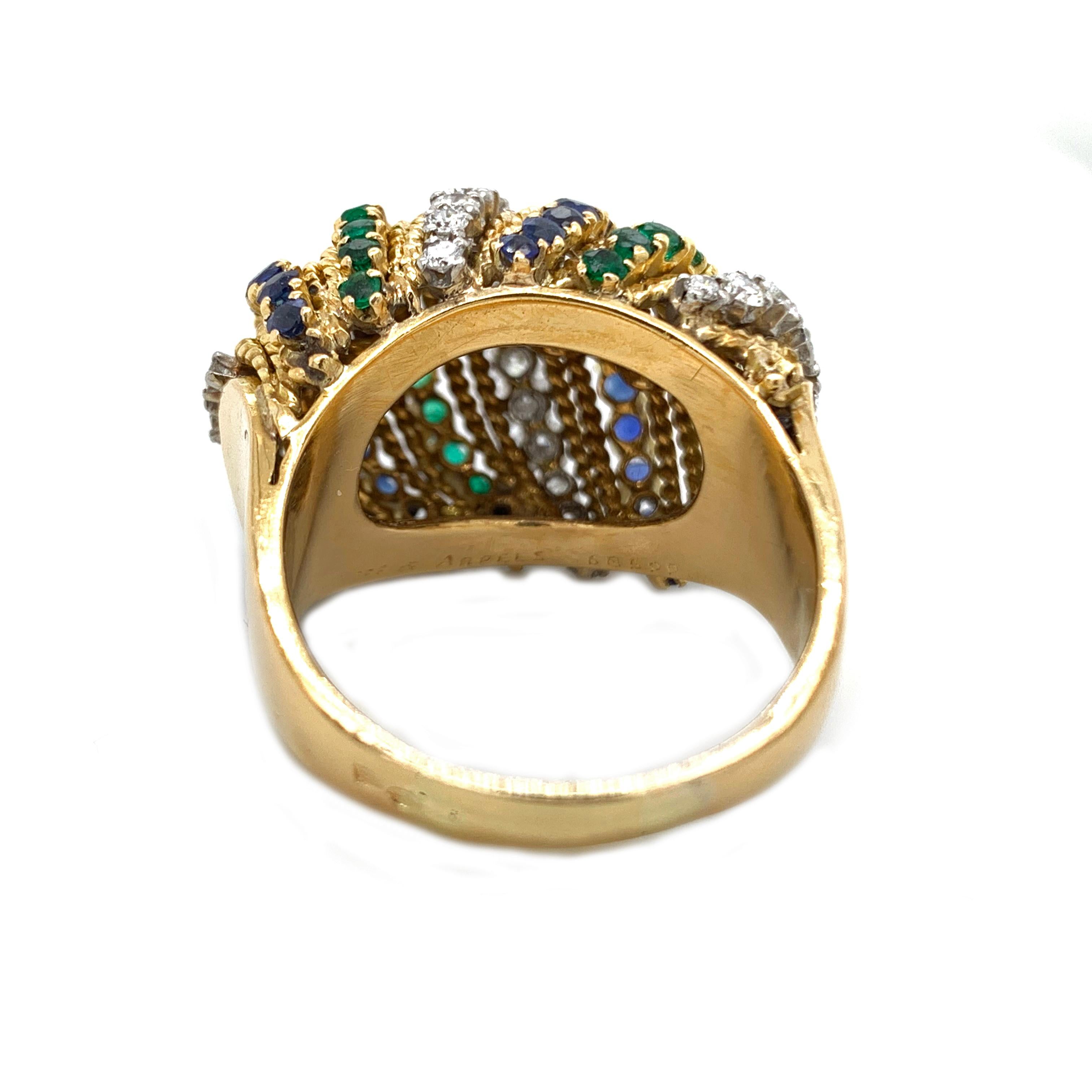 This, beautiful and iconic dome ring from Van Cleef's & Arpels was made in the 1960's it beautifully incorporates Emeralds, Sapphires & Diamonds in a swinging striped pattern. Mounted, in 18kt yellow gold in a US Ring size 9.
Weigh: 14.0g

