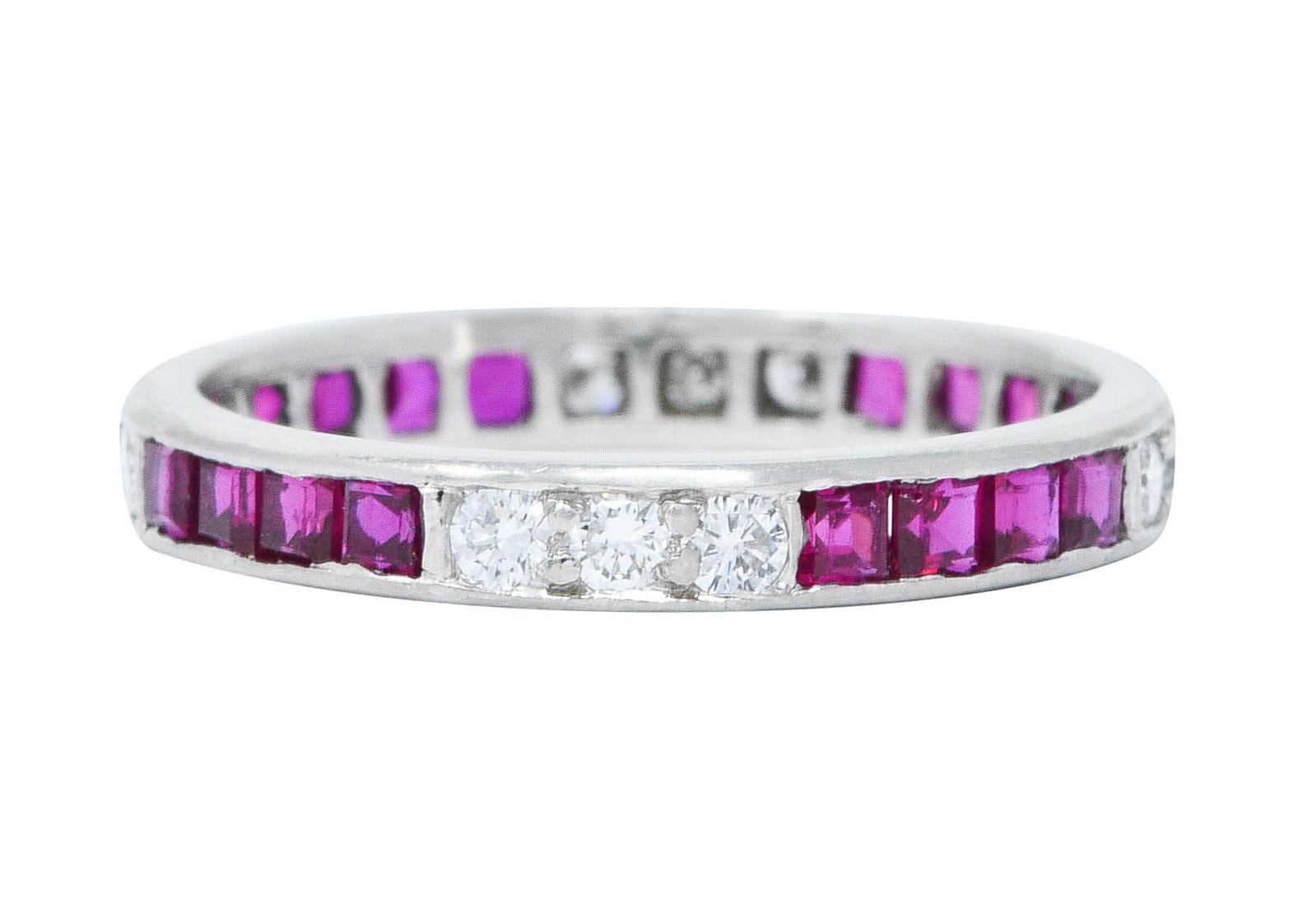 Eternity band ring features round brilliant diamonds alternating with square cut rubies

Diamonds are bead set while weighing in total approximately 0.36 carat - G to I color with SI clarity

Rubies are channel set while weighing in total