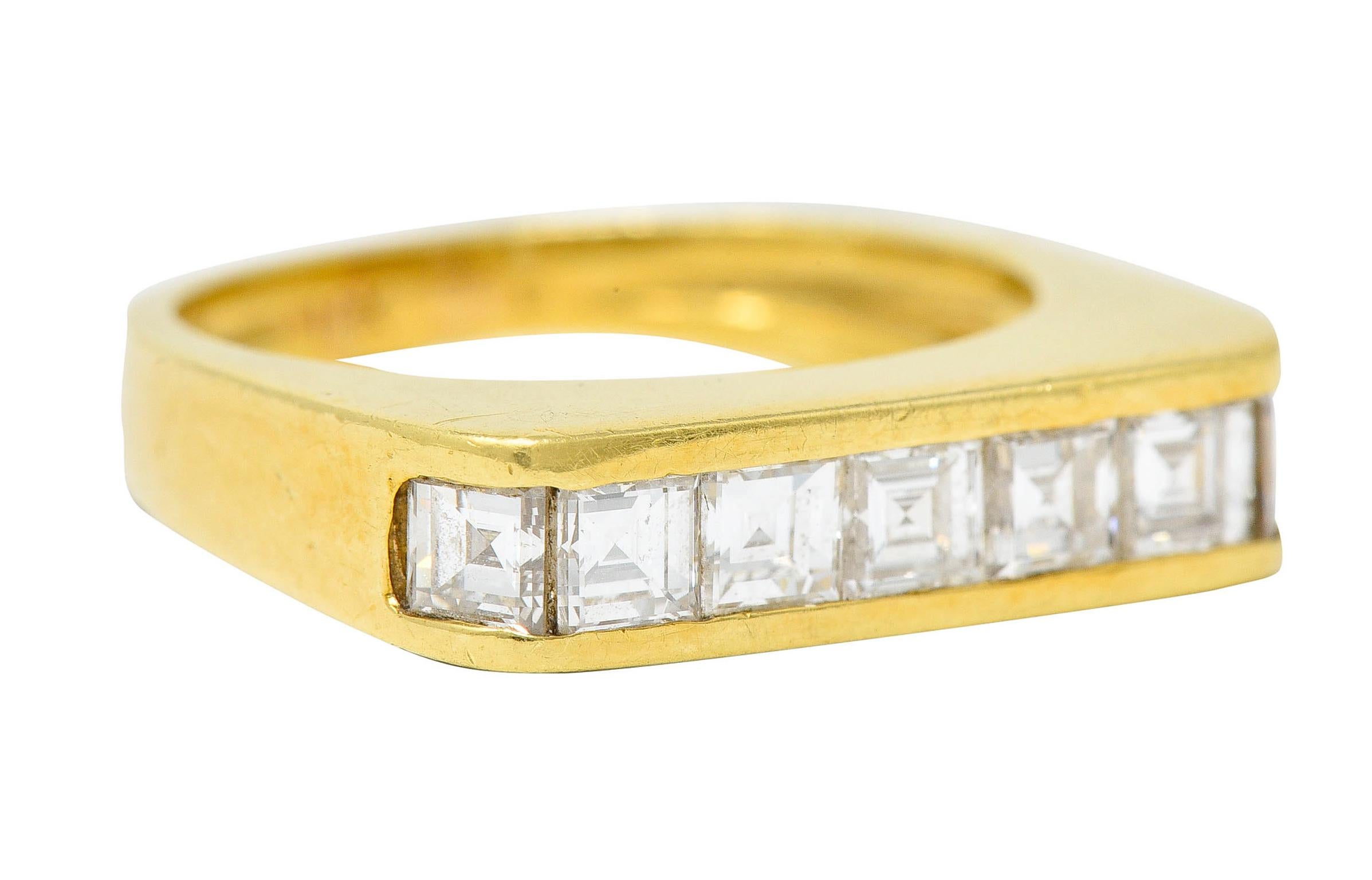 Band ring is channel set East to West with square cut diamonds

Weighing in total approximately 1.25 carats with G to I color and VS clarity

With maker's mark and stamped 18K for 18 karat gold

Circa: 1960s

Ring Size: 6 & sizable

Measures: 4.7 mm