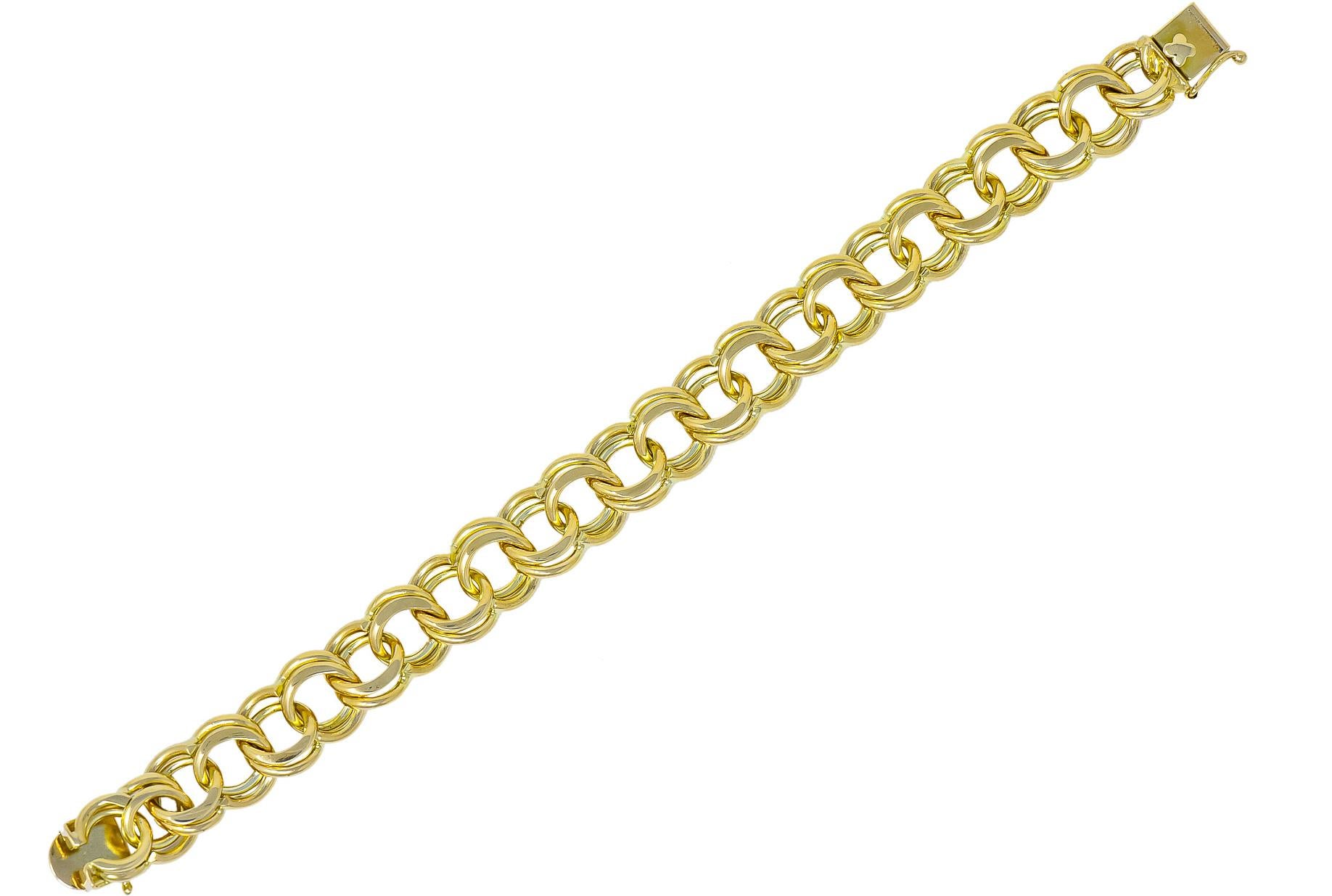 Link style charm bracelet with high polished figure eight curbed links

With faceted detail

Completed by concealed clasp and figure eight safety

Stamped 14k for 14 karat gold

Length: 8 inches

Width: 1/2 inch

Total weight: 47.3 grams

Chunky.