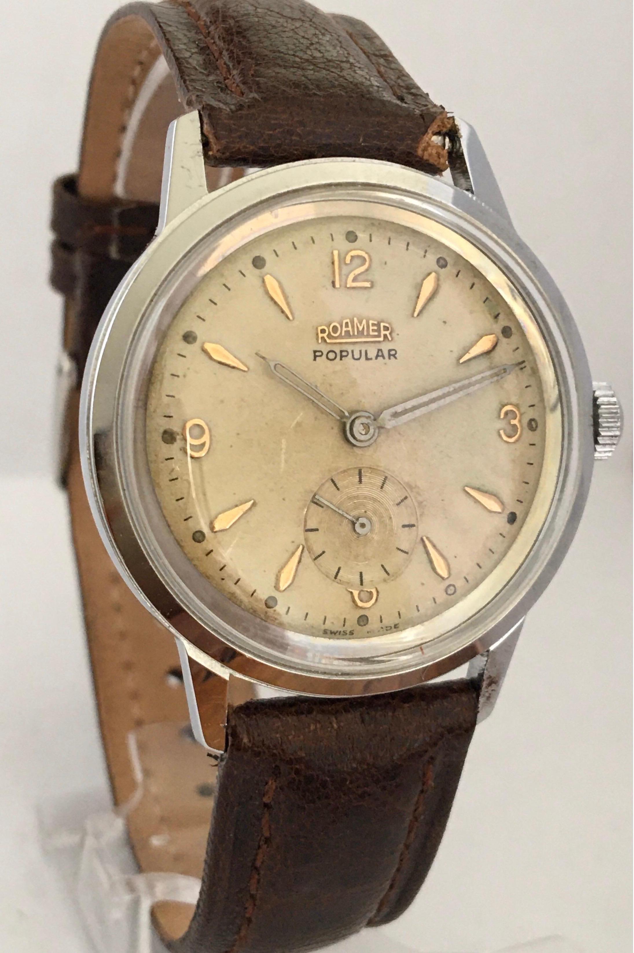 This pre-owned vintage manual winding Swiss Watch is in good Working condition and it is ticking well. Visible  signs of ageing and wear. With small and light scratches on the glass and some light marks on the beige dial. It is fitted with brown