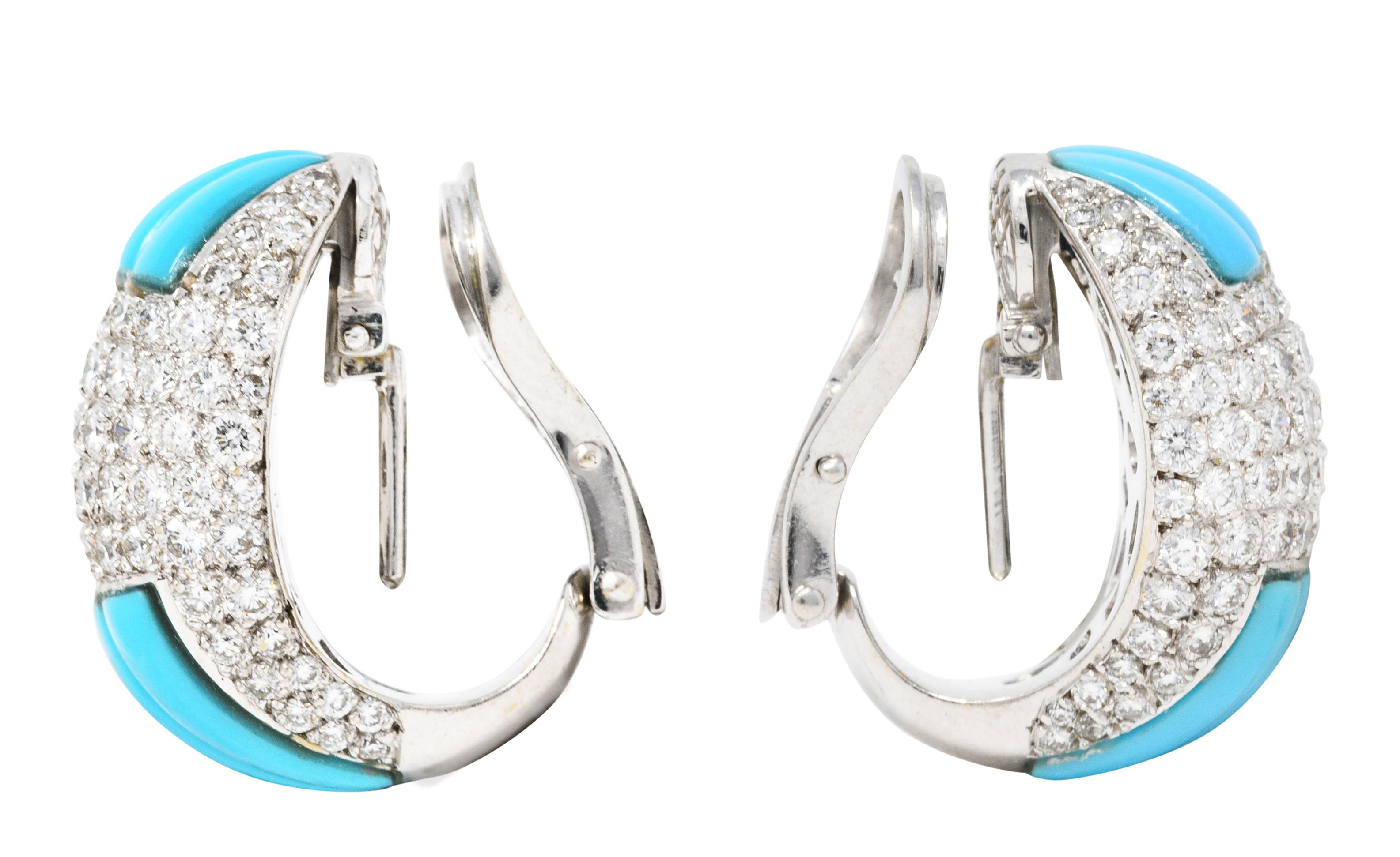 J hoop earrings are pavè set with round brilliant cut diamonds

Weighing in total approximately 4.00 carats with G/H color and VS clarity

Flanked North and South by fine robin's egg blue turquoise with deeply carved fluting

Completed by optional