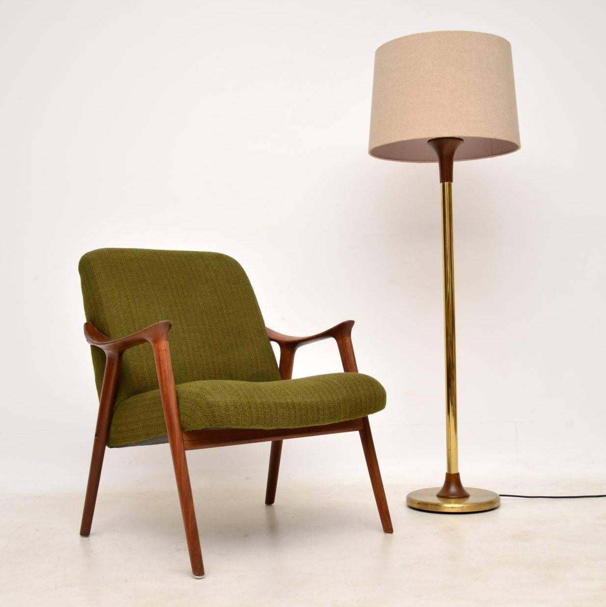 A stunning vintage armchair in solid afromosia wood, this was designed by Ingmar Relling, it was made in Norway by Westnofa in the 1960s. The condition is superb throughout, we have had this newly upholstered in a lovely dark green tweed wool