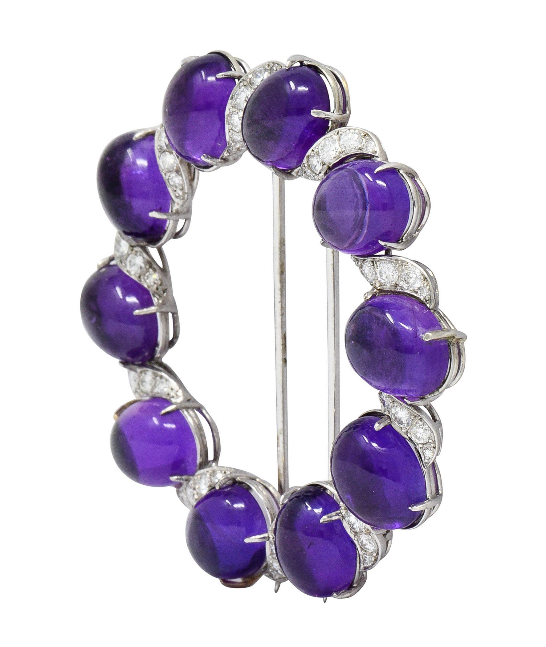 Circular brooch is comprised of ten oval amethyst cabochons; measuring approximately 10.0 x 8.5 mm

Very well-matched in purple color and translucent with natural inclusions

Alternating with swiveled white gold stations accented by round brilliant