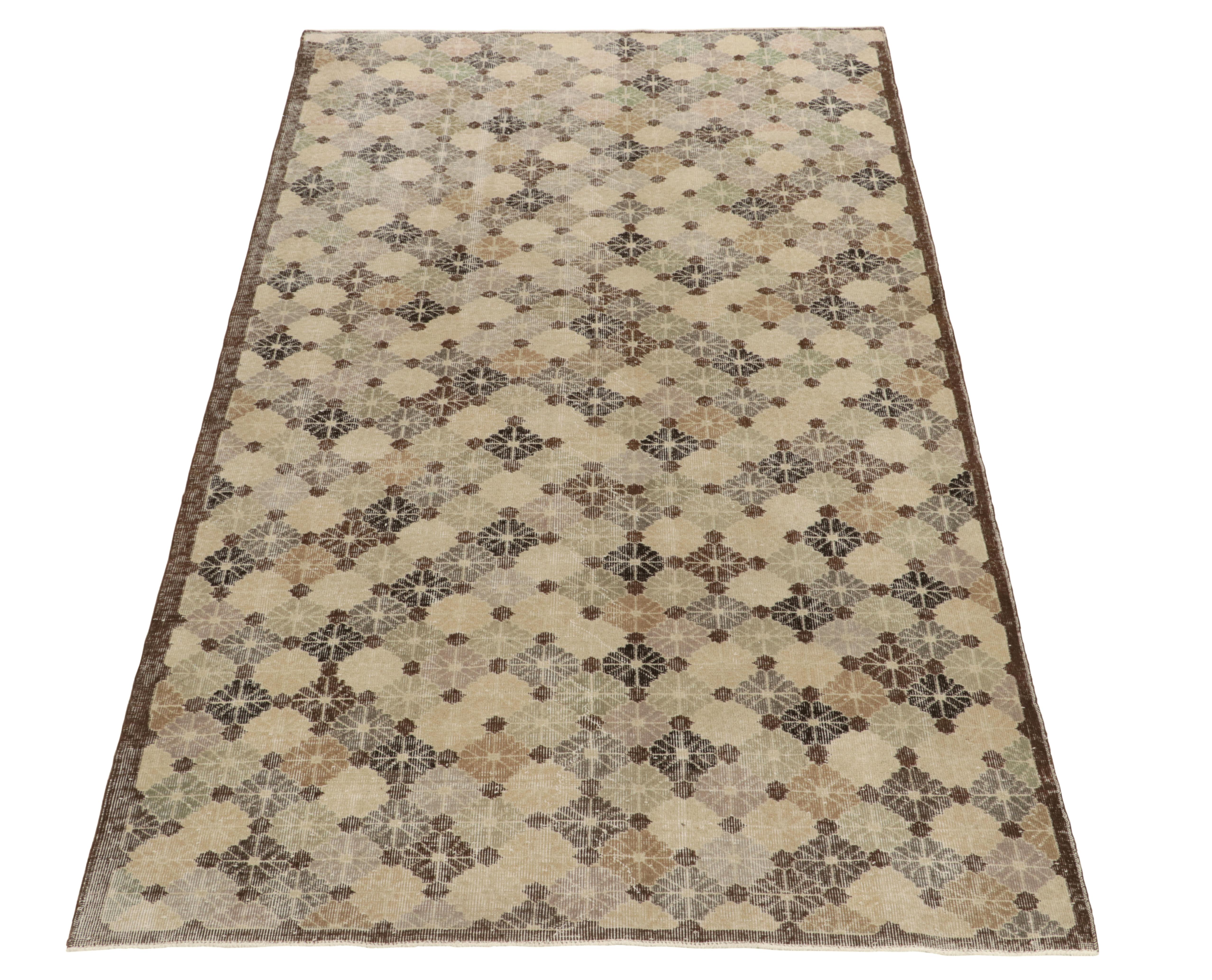 A 6x10 vintage rug exemplifying unique Turkish art deco sensibilities, among the latest in our Mid-Century Pasha Collection. Commemorating a bold Turkish designer, this 1960s piece features refined floral patterns in pale tones of green, blue, and