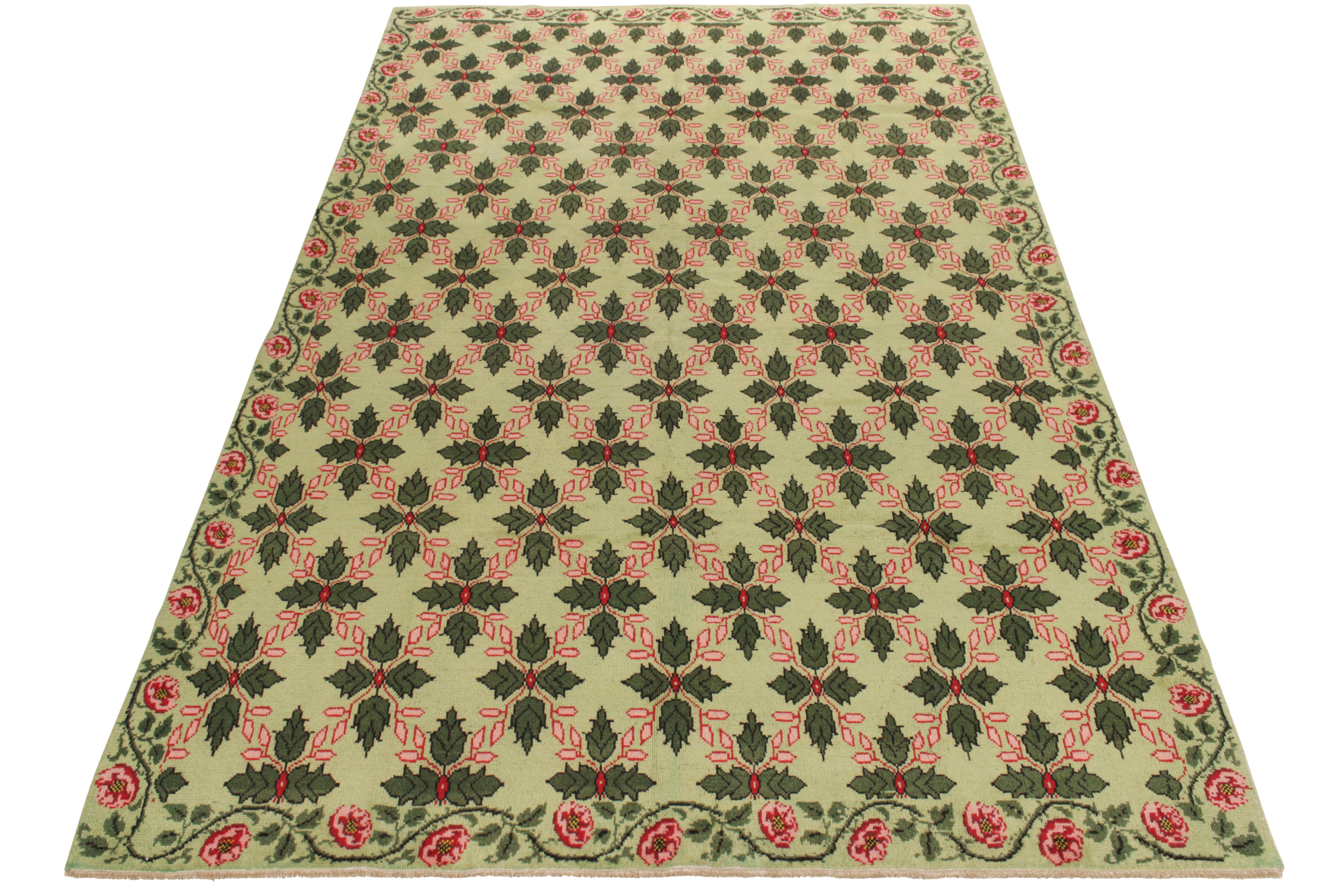 Hand-knotted in wool from Turkey circa 1950-1960, a 7X11 vintage rug from an iconic Turkish designer, commemorated in Rug & Kilim’s growing Mid-Century Pasha Collection. The 1960s style enjoys a gorgeous floral pattern in forest green, pink and