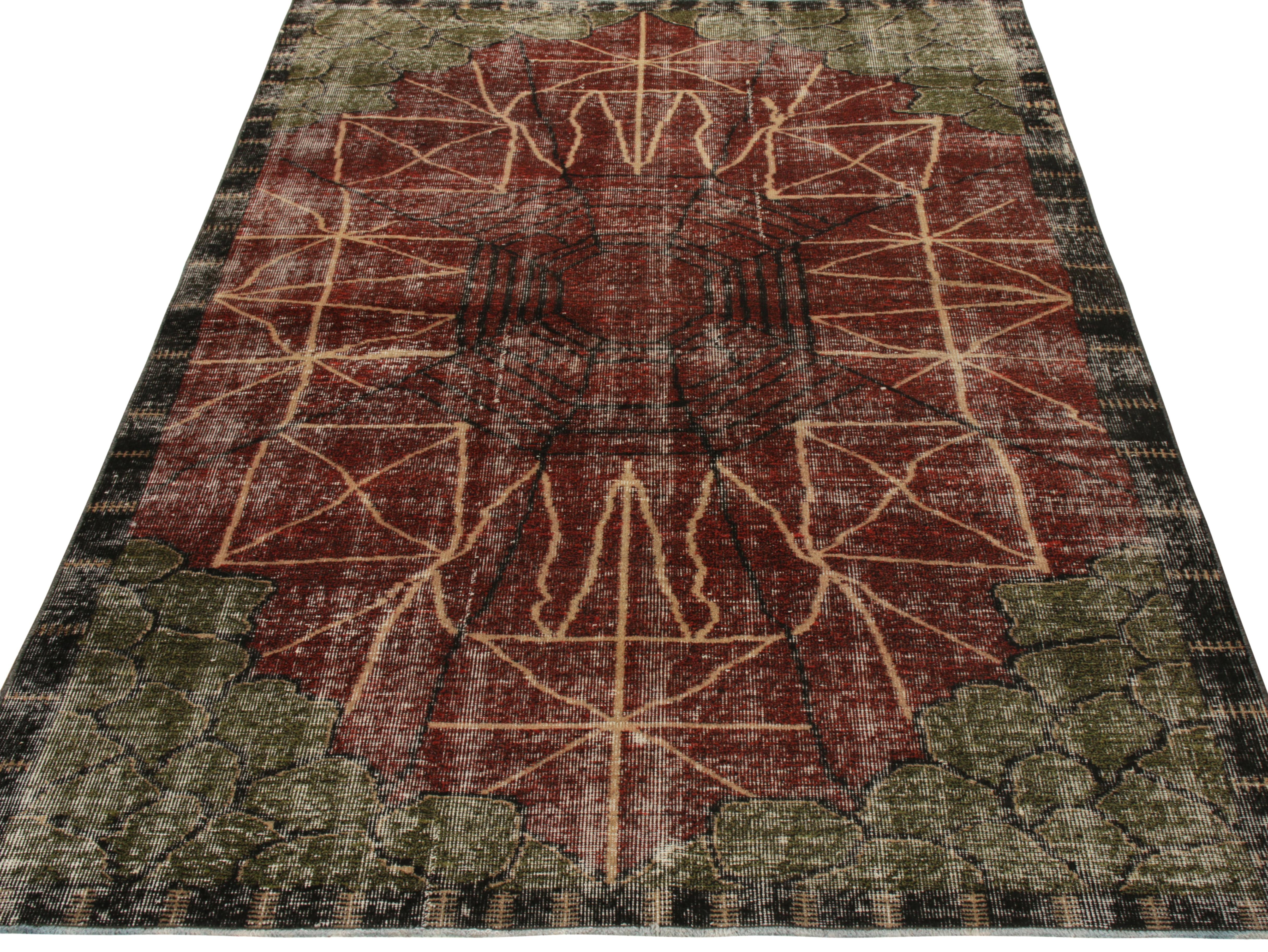 Hand-knotted in woo from Turkey circa 1960-1960l, a 5x8 Mid-Century Modern rug in Art Deco style from Rug & Kilim’s growing Mid-Century Pasha Collection. Featuring a well defined geometric pattern in peach and black on a red and green backdrop, the