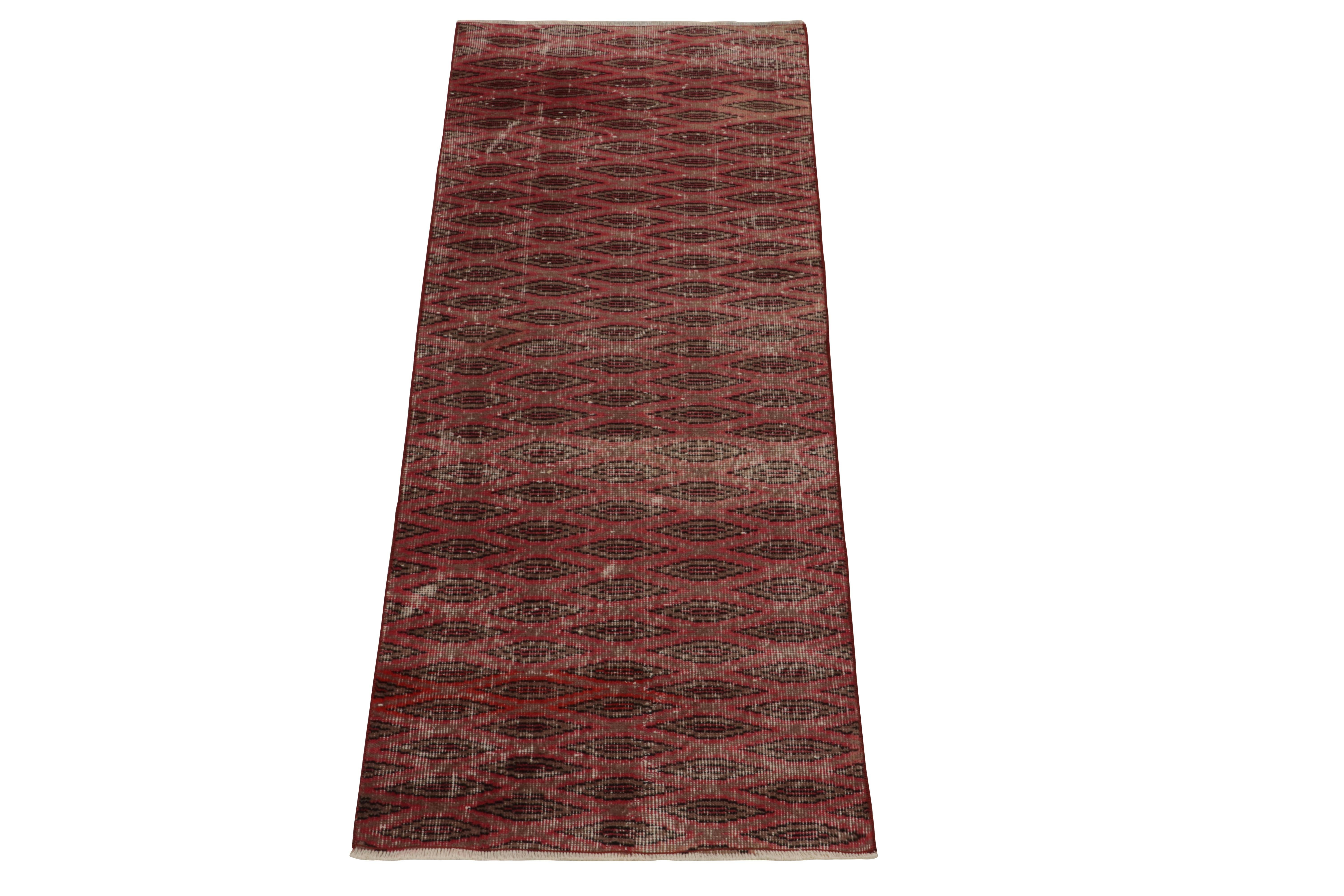 A 2 x 6 vintage runner exemplifying rare Turkish art deco sensibilities, among the latest to join our Mid Century Pasha Collection. Coming from a bold Turkish designer, this 1960s piece features a well defined geometric pattern in deep red, brown