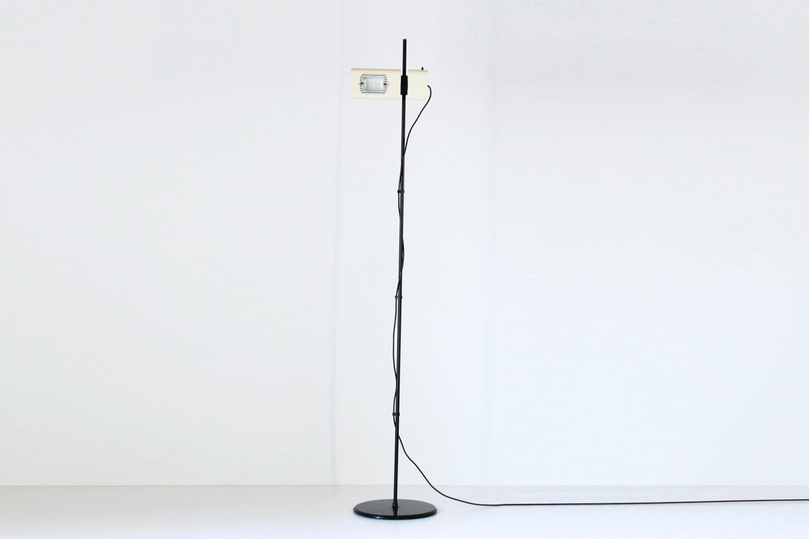 A 1970s Artemide floor lamp with adjustable light spot and light intensity. Beautiful signs of time and perfectly working. Electric parts have been revised. Gismondi designer for Artemide Milano.