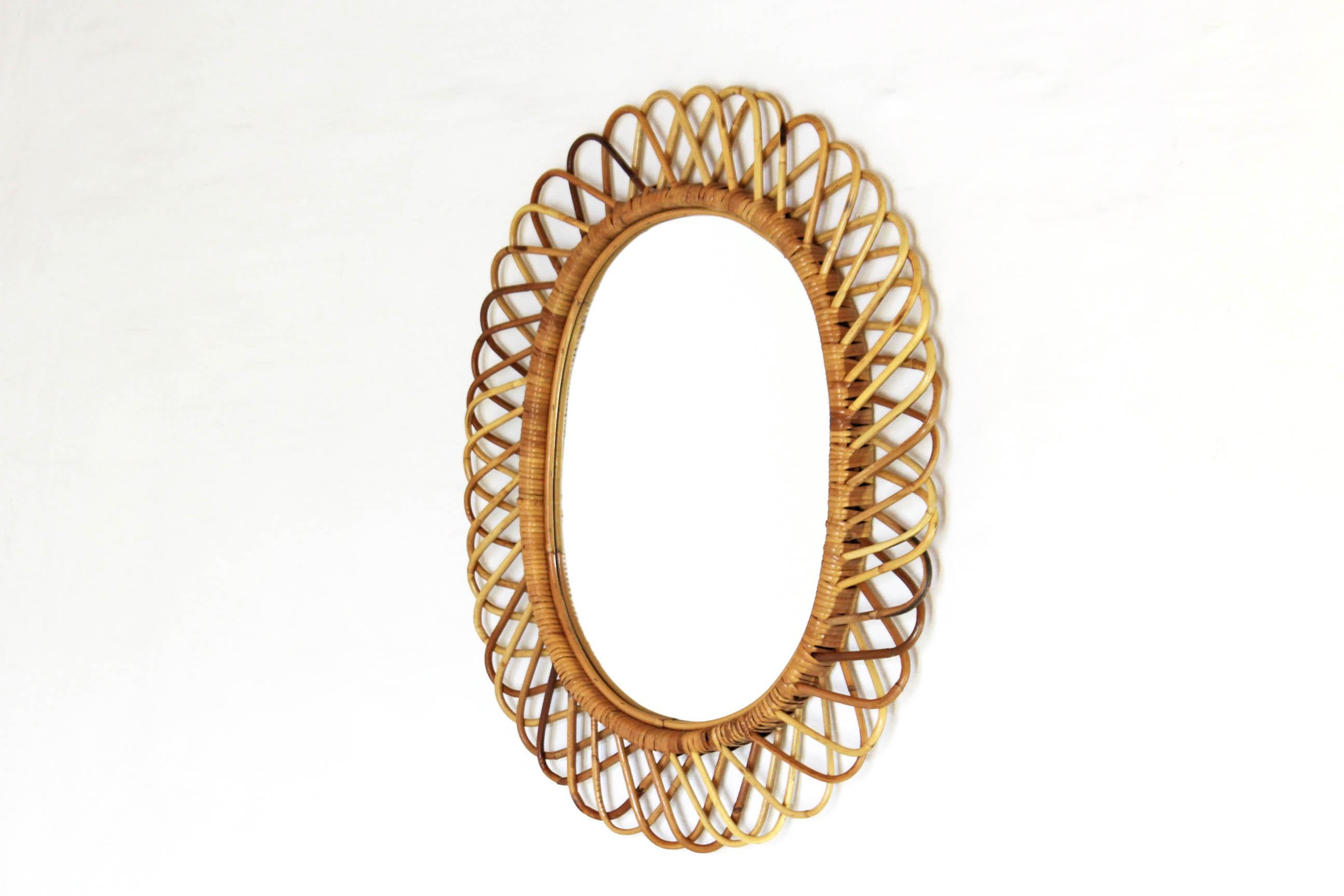 A 1960s vintage wall mirror with curved bamboo frame. Attributed to Franco Albini. famous italian designer of the time. In very good conditions.