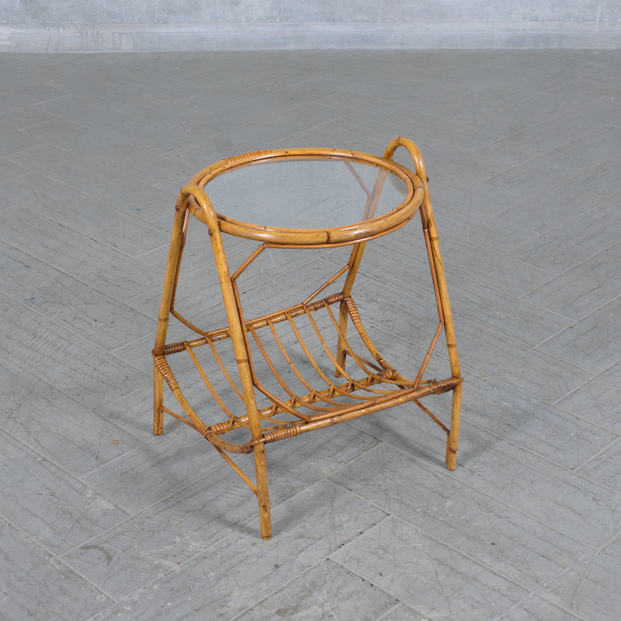 Introduce a touch of vintage charm to your living space with our beautifully restored 1960s Bamboo Side Table, complete with a Magazine Rack. This exquisite piece exemplifies the elegance and functionality of mid-century design, making it a perfect
