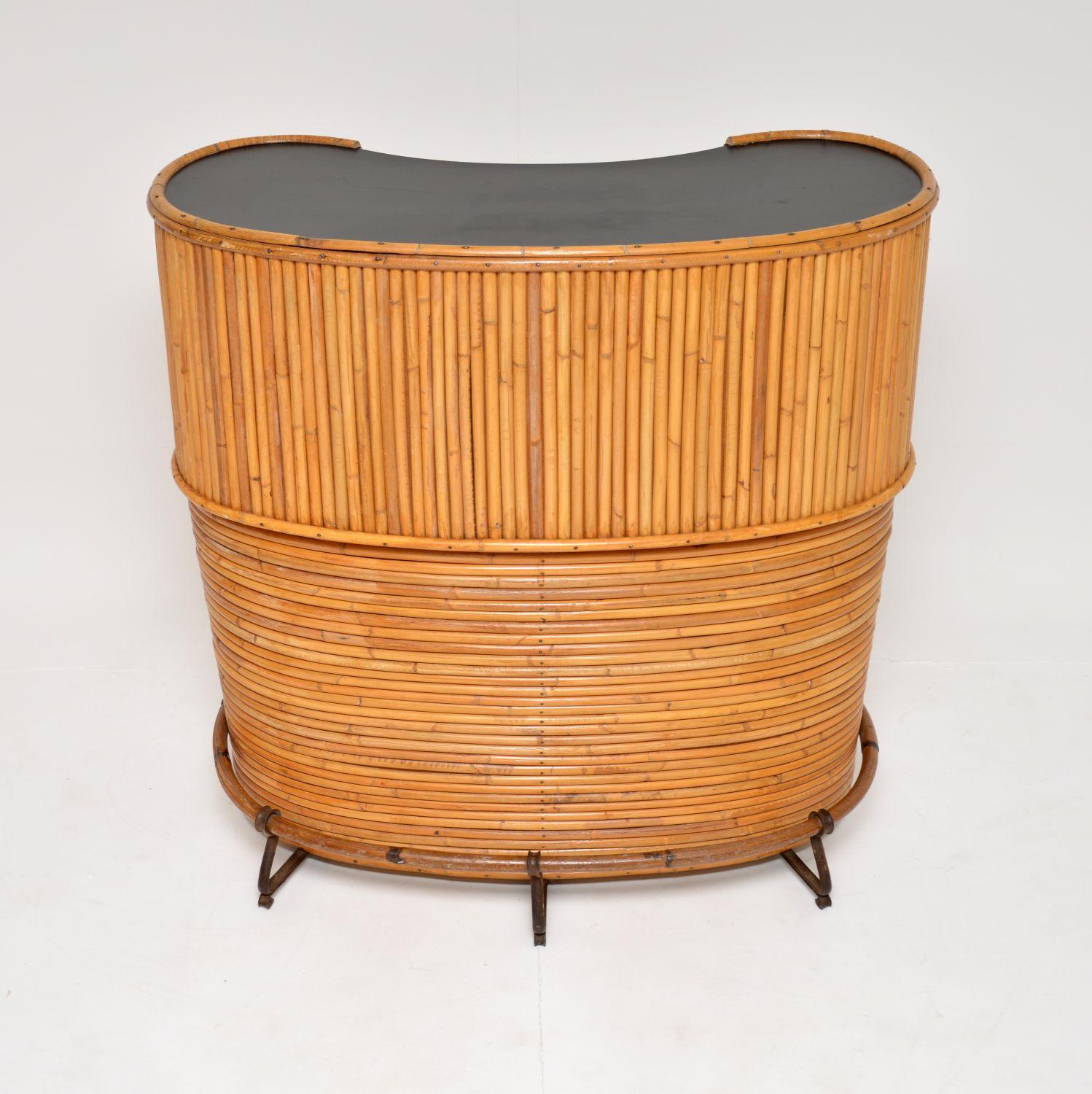 A fabulous vintage bamboo tiki cocktail drinks bar / cabinet. This was made in England, it dates from the 1960-70’s.

It is really well made, with a super stylish design. The overall shape is slightly curved, with a formica kidney shaped top,