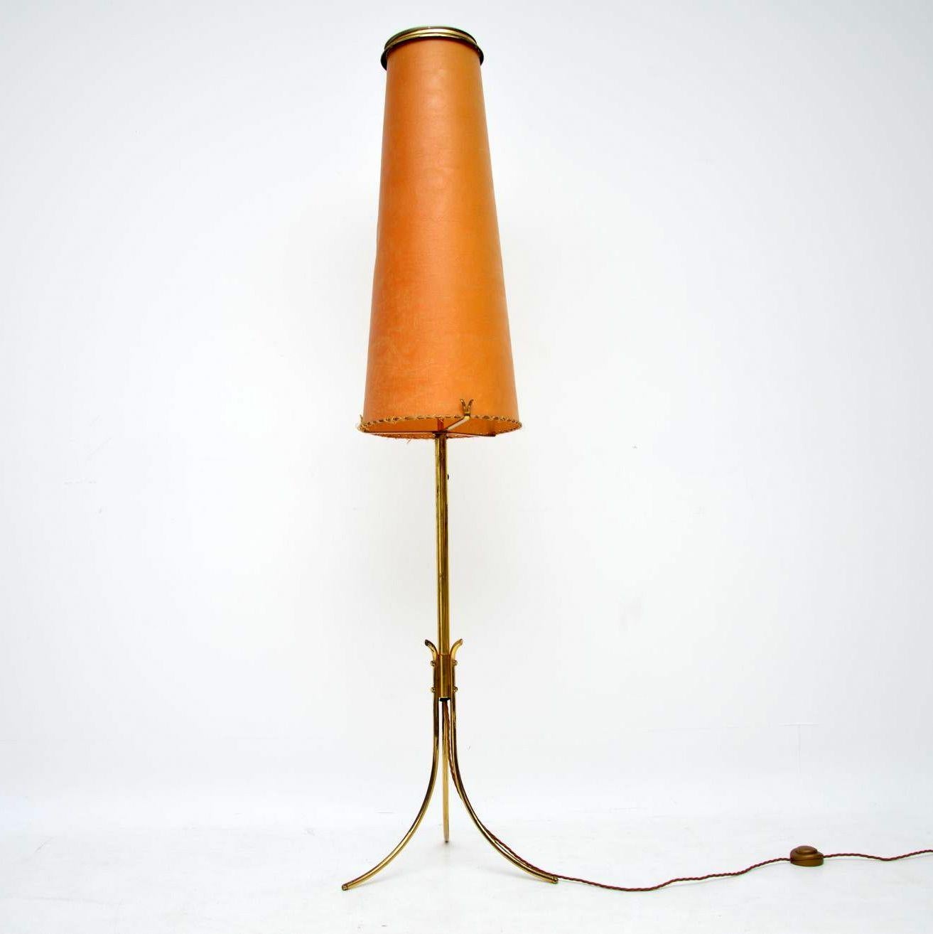 A beautiful and stylish vintage lamp from the 1960’s, this has a brass tripod base and original paper shade in leather effect. This has been re-wired and is in good working order, it’s in good vintage condition with some surface wear here and there.