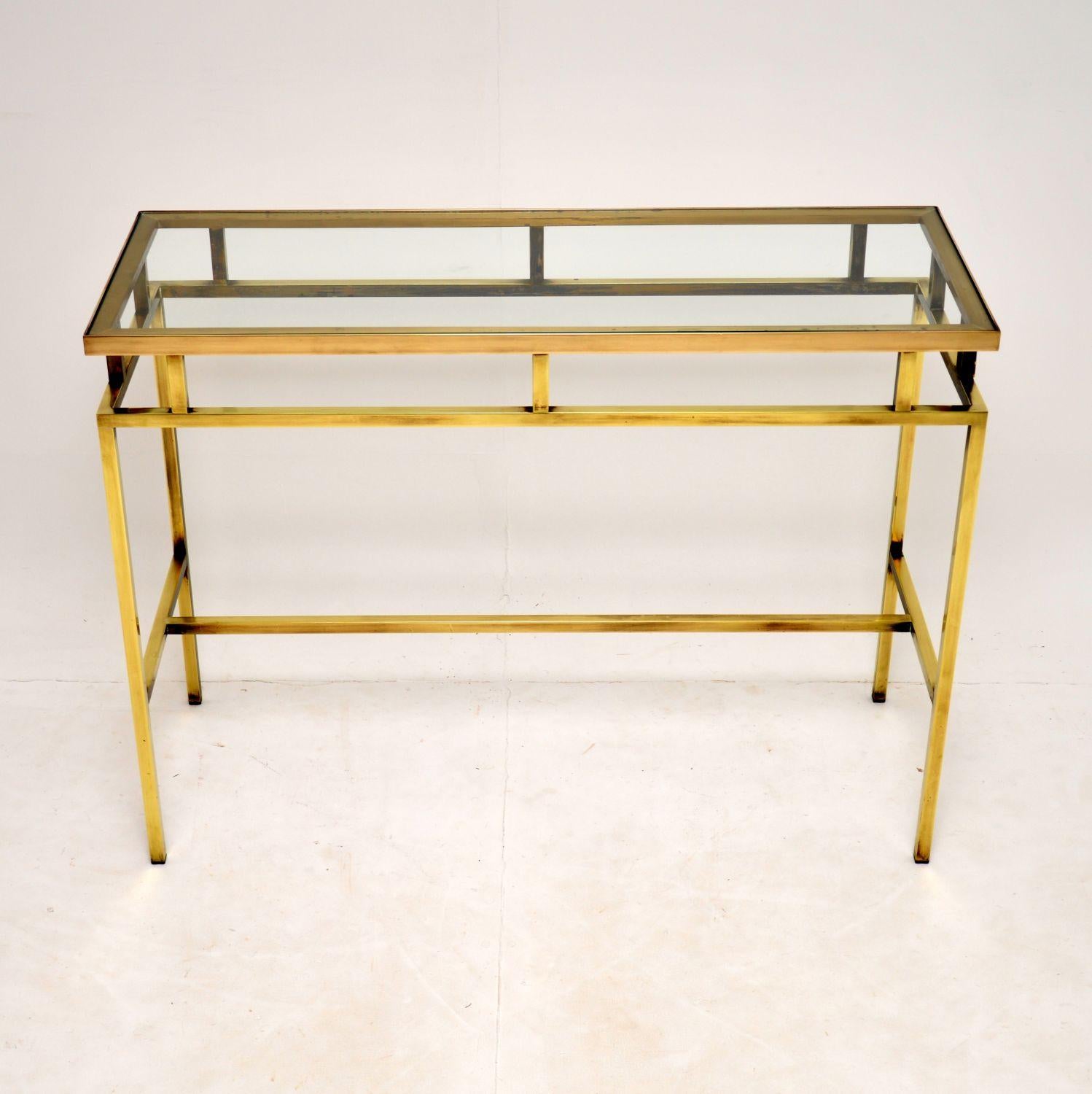 A top quality vintage solid brass console table, dating from the 1960’s. This was most likely made in Italy of France.

It is beautifully made, it is identical front and back so can be used as a free standing item.

The solid brass is in