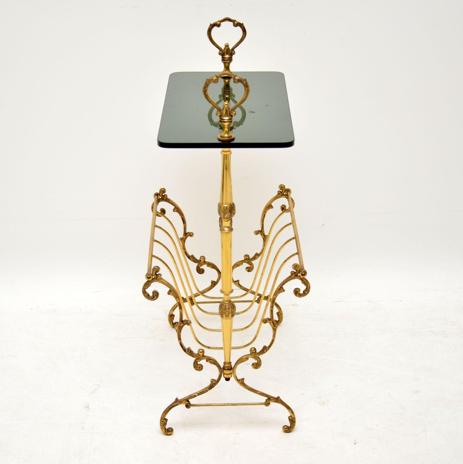 A beautiful and very well made vintage side table in brass, with a fixed glass top and a built in paper rack. This is of excellent quality, has a stunning design and is in superb vintage condition, with only some extremely minor wear. This is a