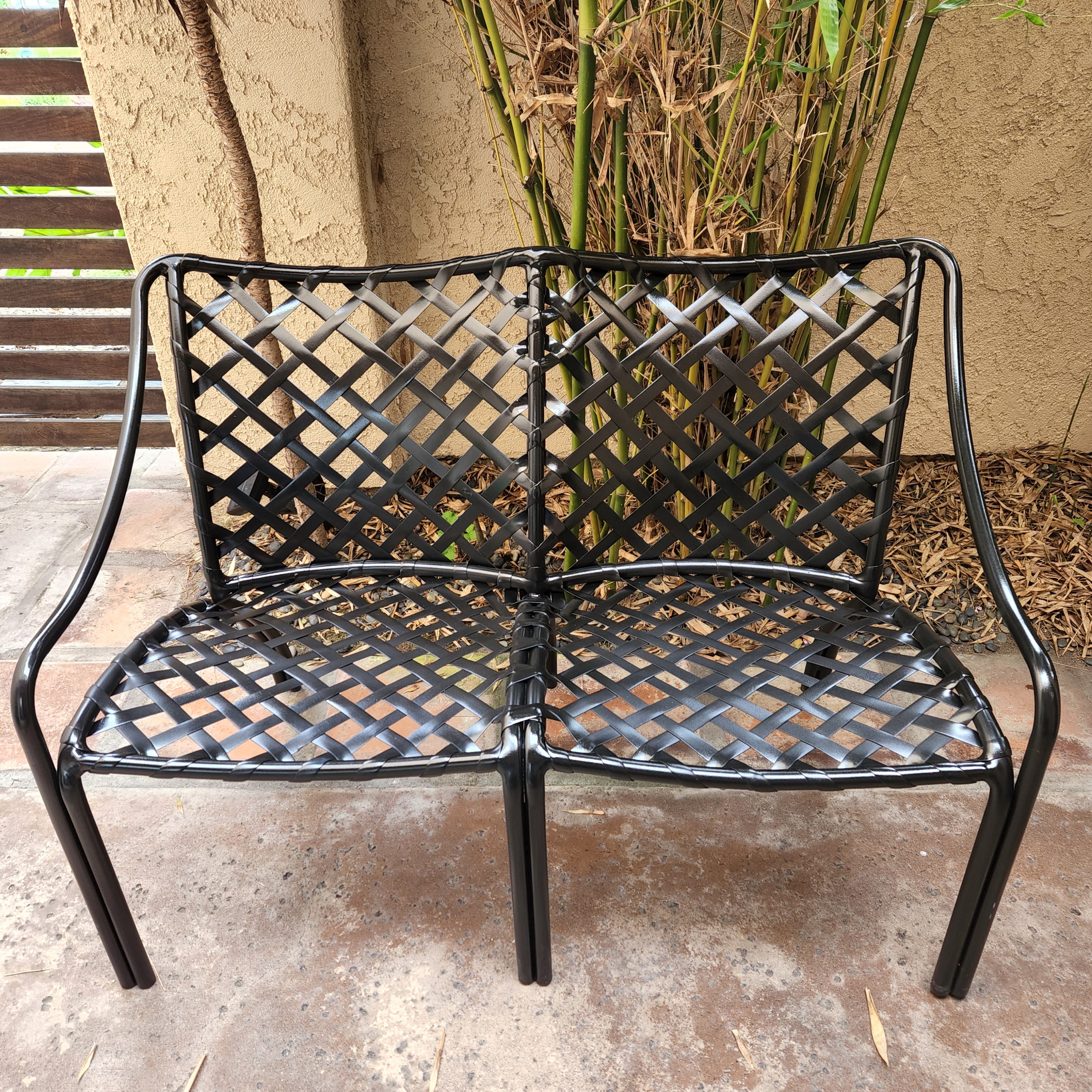 1960s Classic Brown Jordan Patio settee love seat Tamiami in Black
43 w x 31.5 tall x 23 d Seat H 15
Preowned vintage unrestored condition. 
Settee painted black prior to acquisition. Straps are firmly intact. 
Fading and scuffs present. 
Vintage