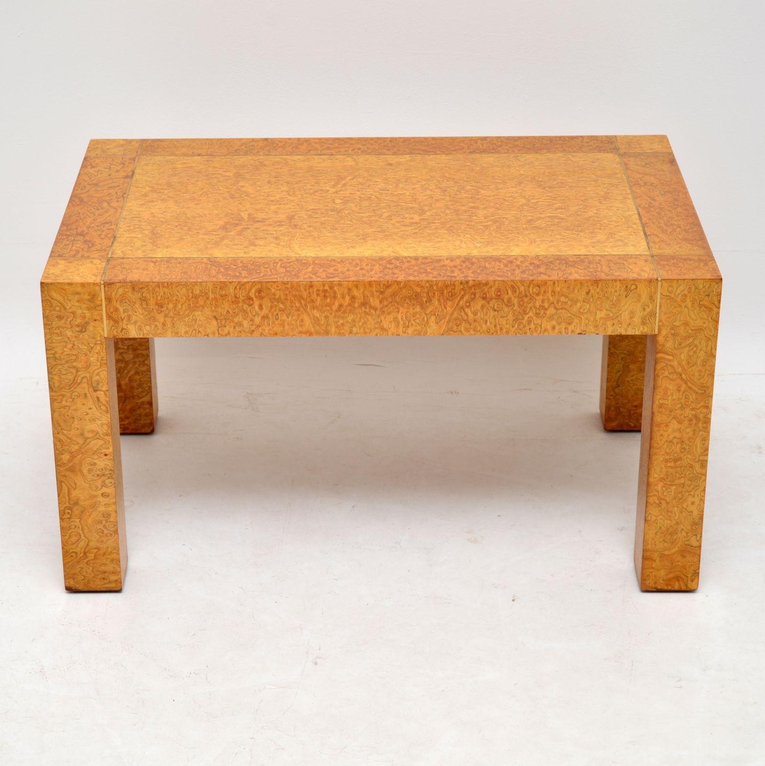 A beautiful and rare vintage coffee table in burr elm, this is by G-Plan, but is far from your average G- Plan coffee table. This was designed by RA Bird, it is beautifully made from burr elm with brass inlay around the top edges. We have had this