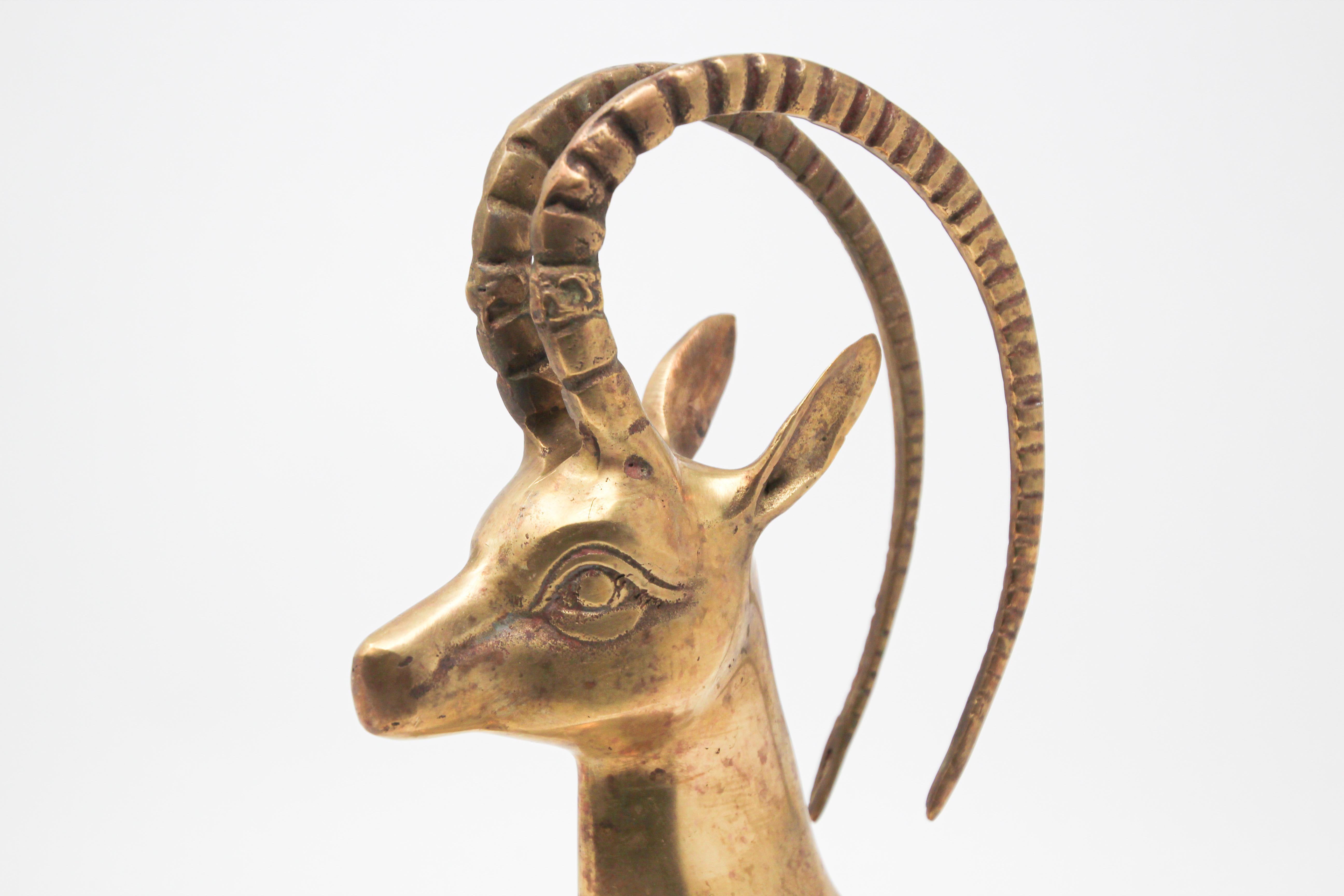 1960s vintage cast brass sculpture of gazelle ibex head
Gazelle head Hollywood Regency brass gazelle head.
The perfect midcentury / Hollywood Regency accent.
Cast brass metal animal sculpture of a gazelle, deer.
A true Hollywood Regency