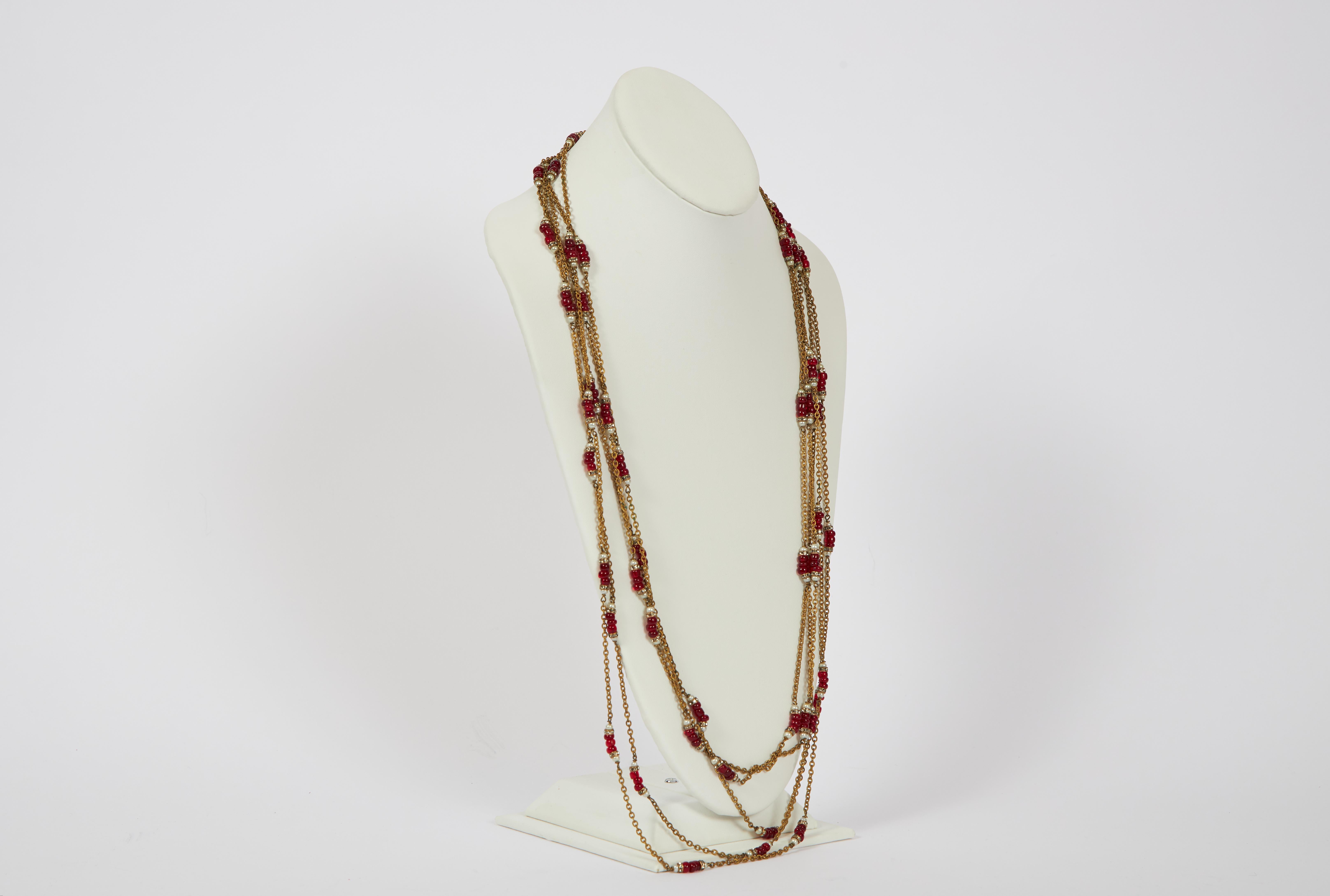 1960s Chanel five-strand graduated chain necklace embellished with red gripoix and faux-pearl beads. Can be worn single or double. Original box included. Minor wear.