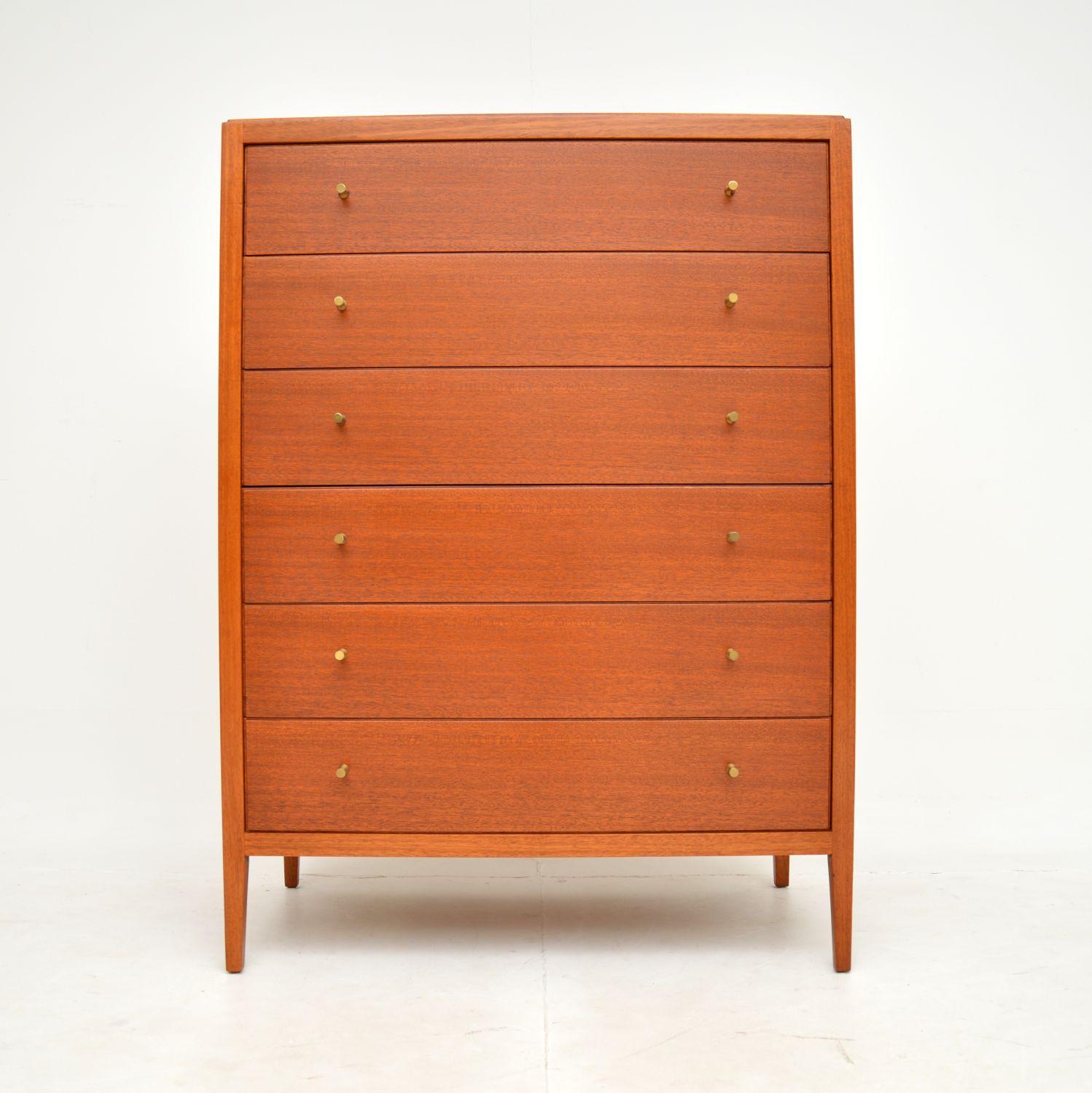 A superb vintage tallboy chest of drawers in wood and brass. This was made by Loughborough furniture in England, it dates from the 1960’s.

It is a fantastic size and is beautifully designed. The quality is amazing, and this has lots of storage