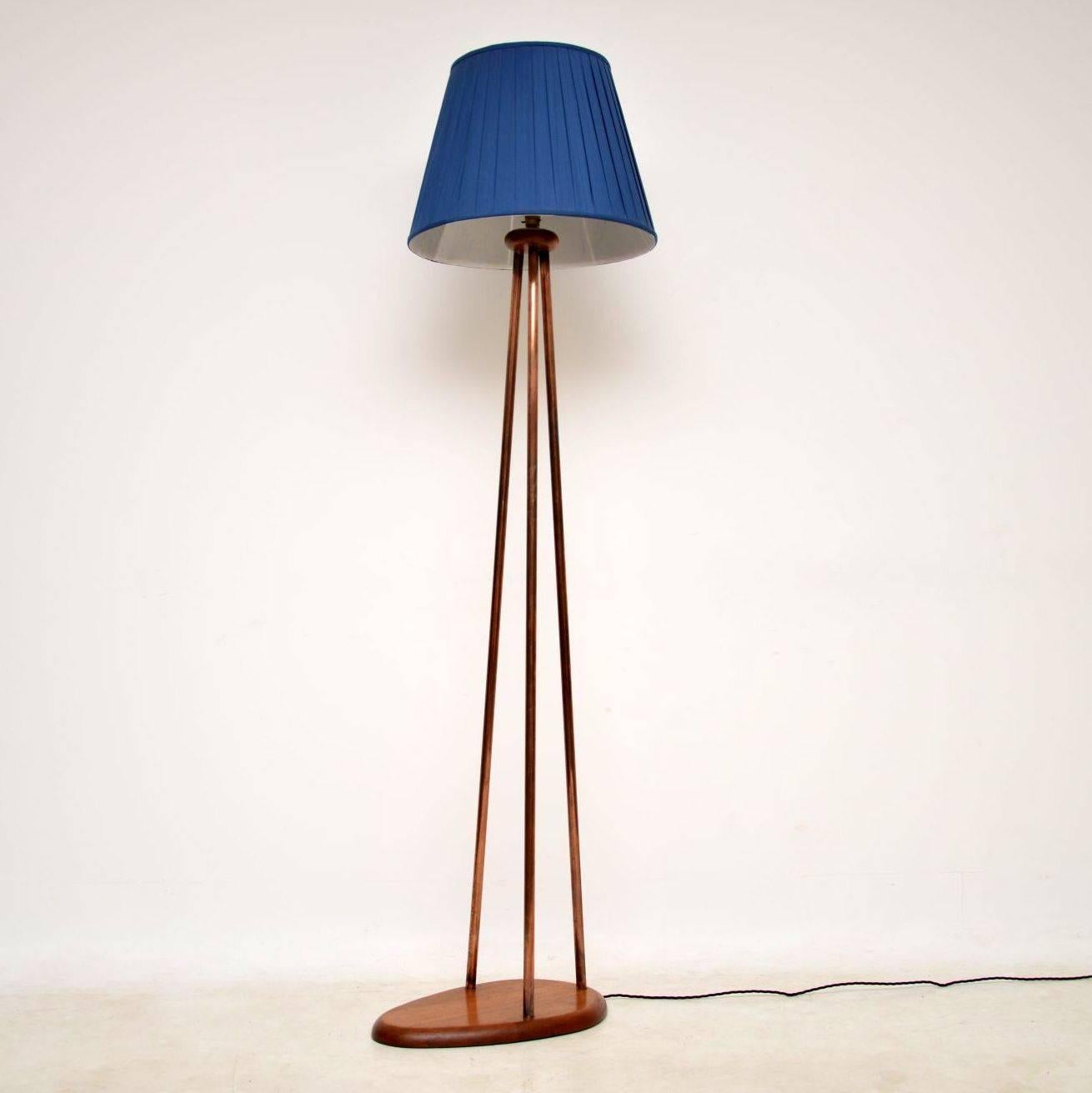 A very stylish and unusual vintage lamp, this dates from around the 1960’s. It has a tripod stand made from copper, which sits on a solid wood base that looks like it’s mahogany, the copper is also joined at the top by a mahogany disc. The condition